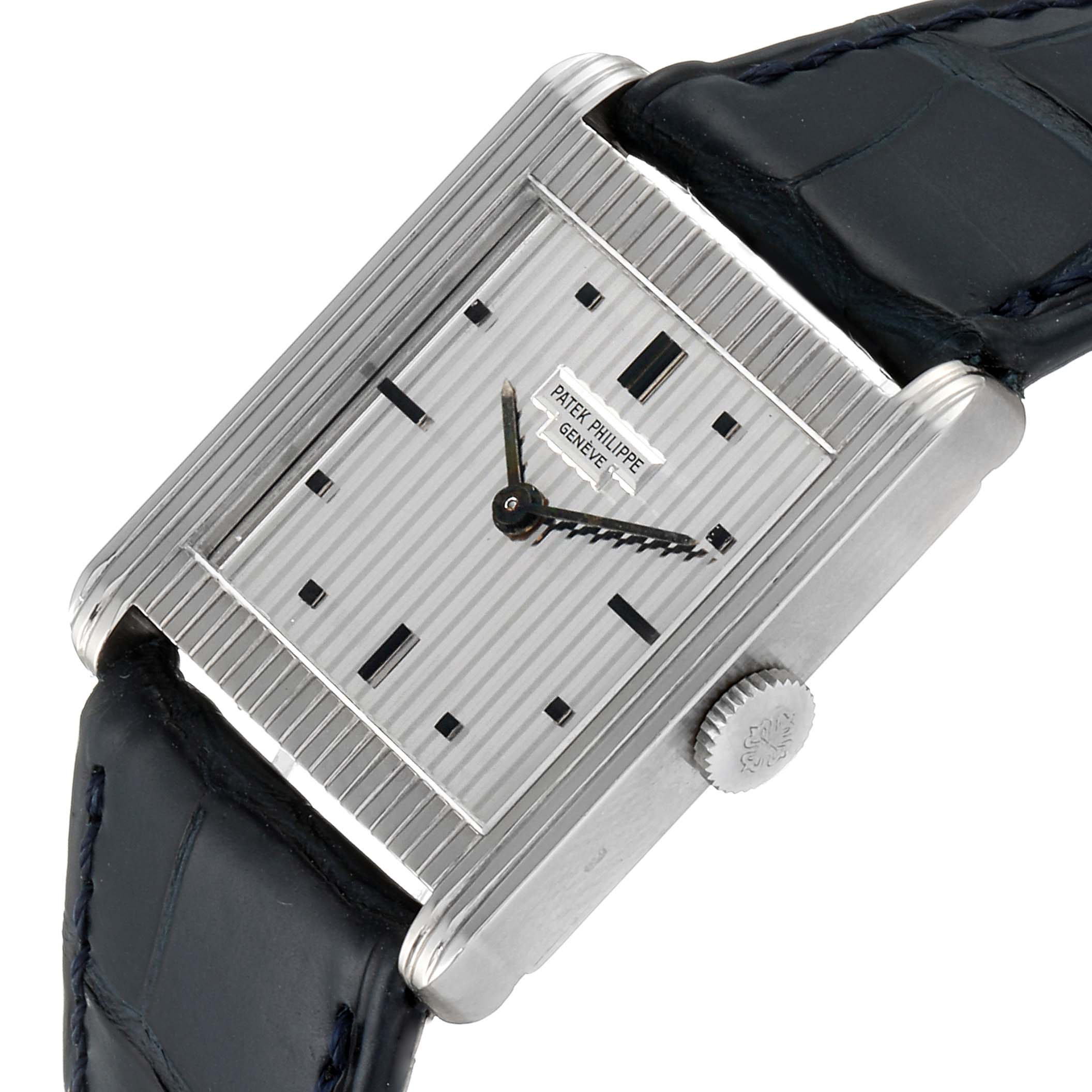 The Patek Philippe Vintage 3467 Men's White Gold Silver Dial 3467 Men's White Gold Silver Dial model watch is shown from an angled top view, highlighting the dial, hands, crown, and leather strap.