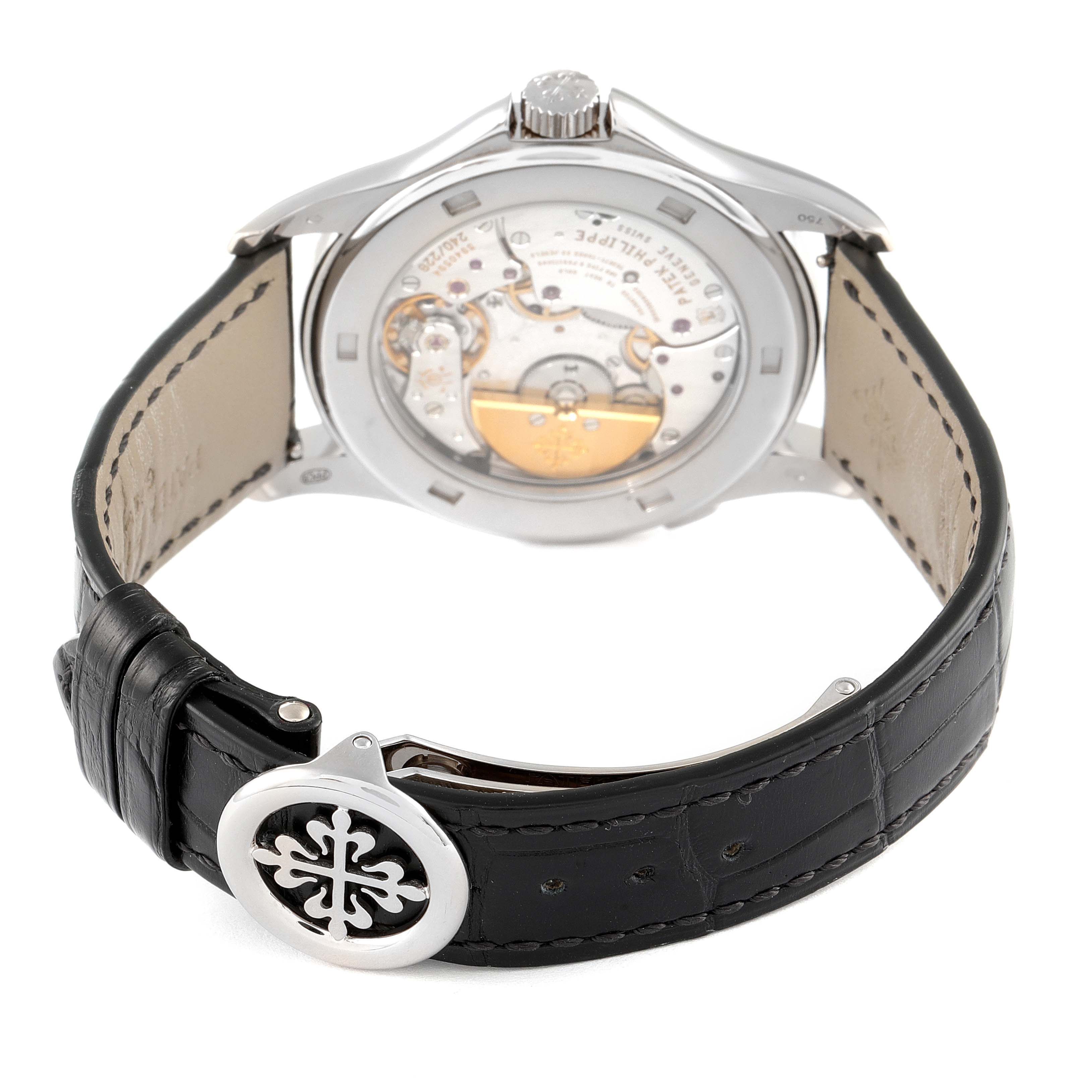 The image shows the back and side of a Patek Philippe Complications 5130G-019 Men's Stainless Steel Silver Dial 5130G-019 Men's Stainless Steel Silver Dial watch, highlighting its transparent case back and black leather strap.