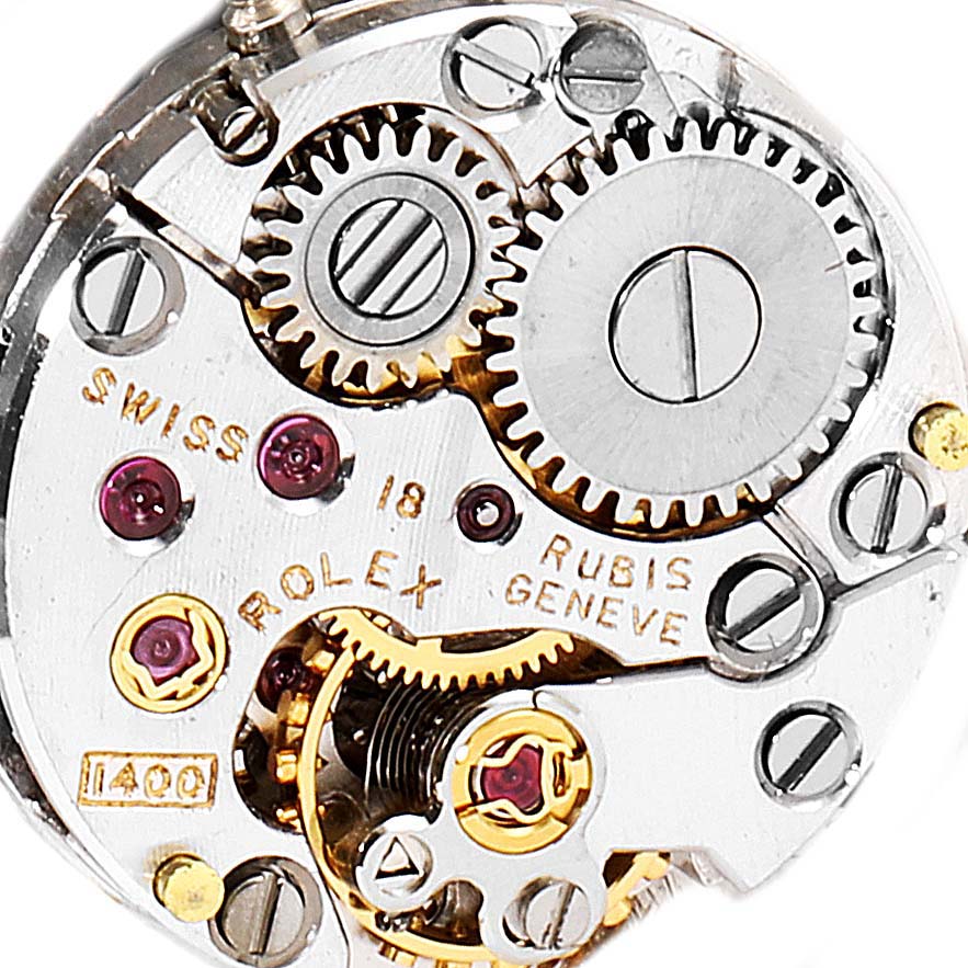 This image shows a close-up view of the internal movement mechanism of a Rolex Cellini 285 Women's White Gold Silver Dial 285 Women's White Gold Silver Dial watch.