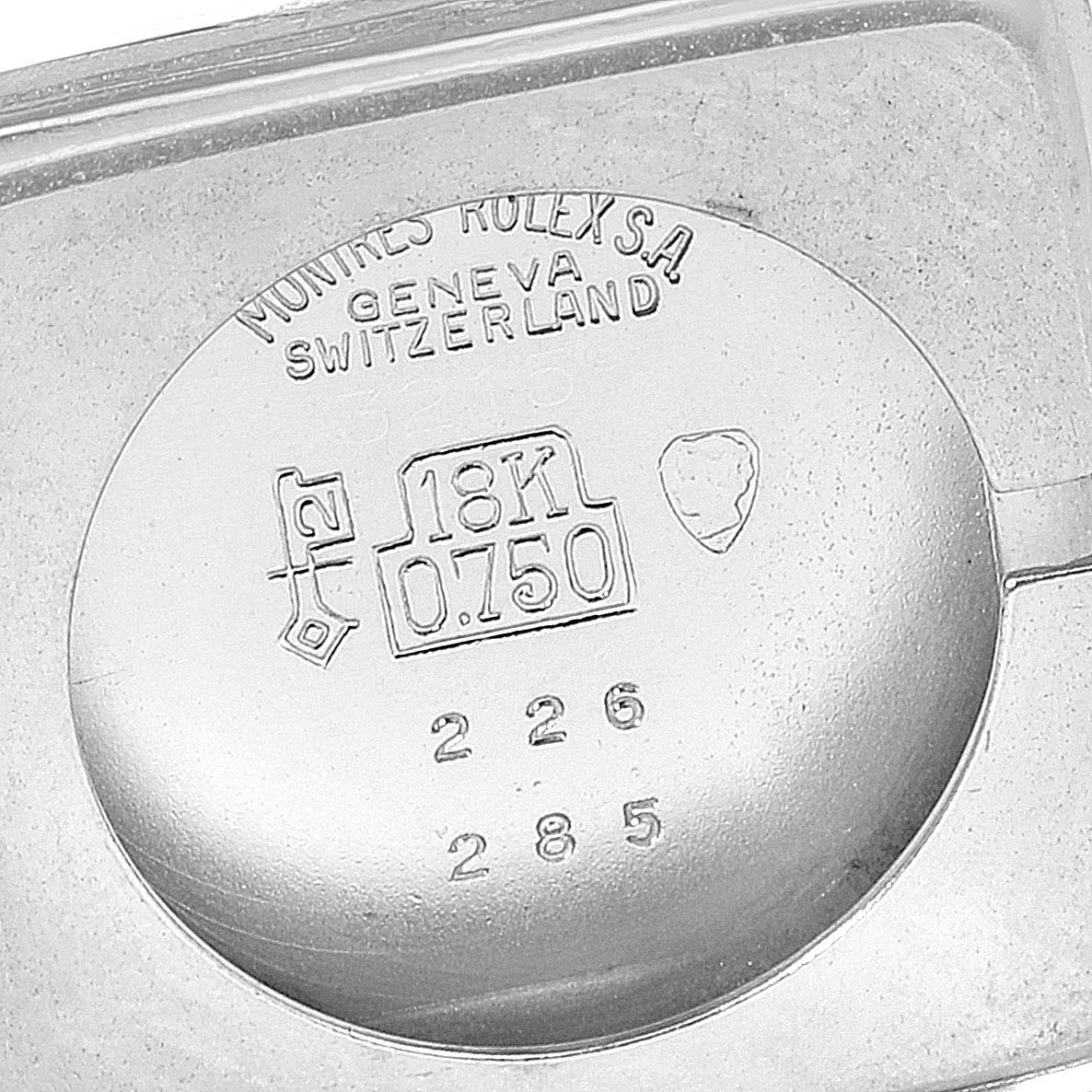 This image shows the interior case back of a Rolex Cellini 285 Women's White Gold Silver Dial 285 Women's White Gold Silver Dial watch, indicating it is made of 18K gold.