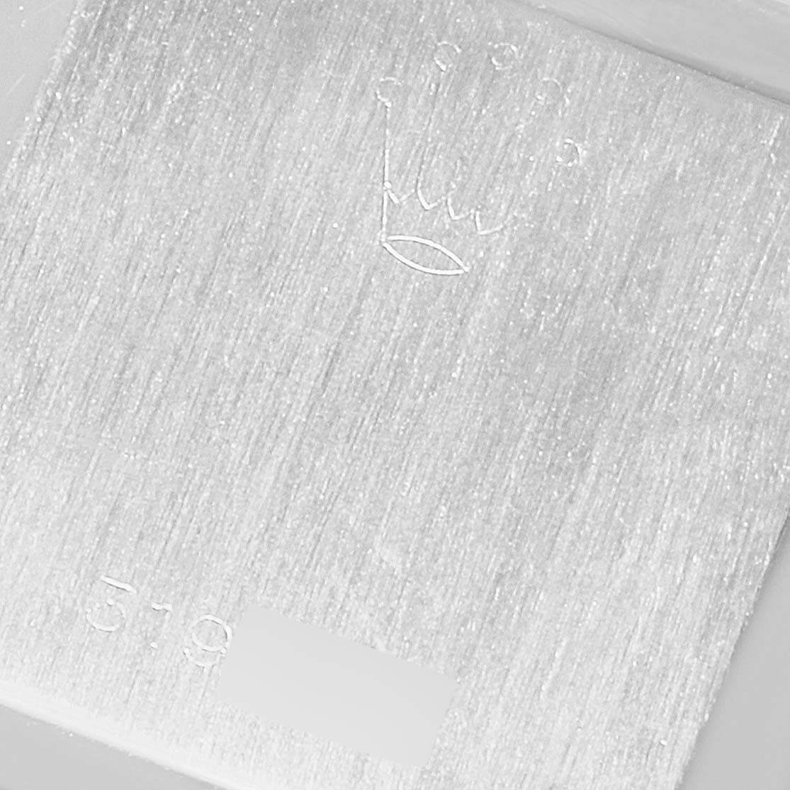 This image shows a close-up of the engraved logo and part number on the back or inner side of a Rolex Cellini 285 Women's White Gold Silver Dial 285 Women's White Gold Silver Dial watch.