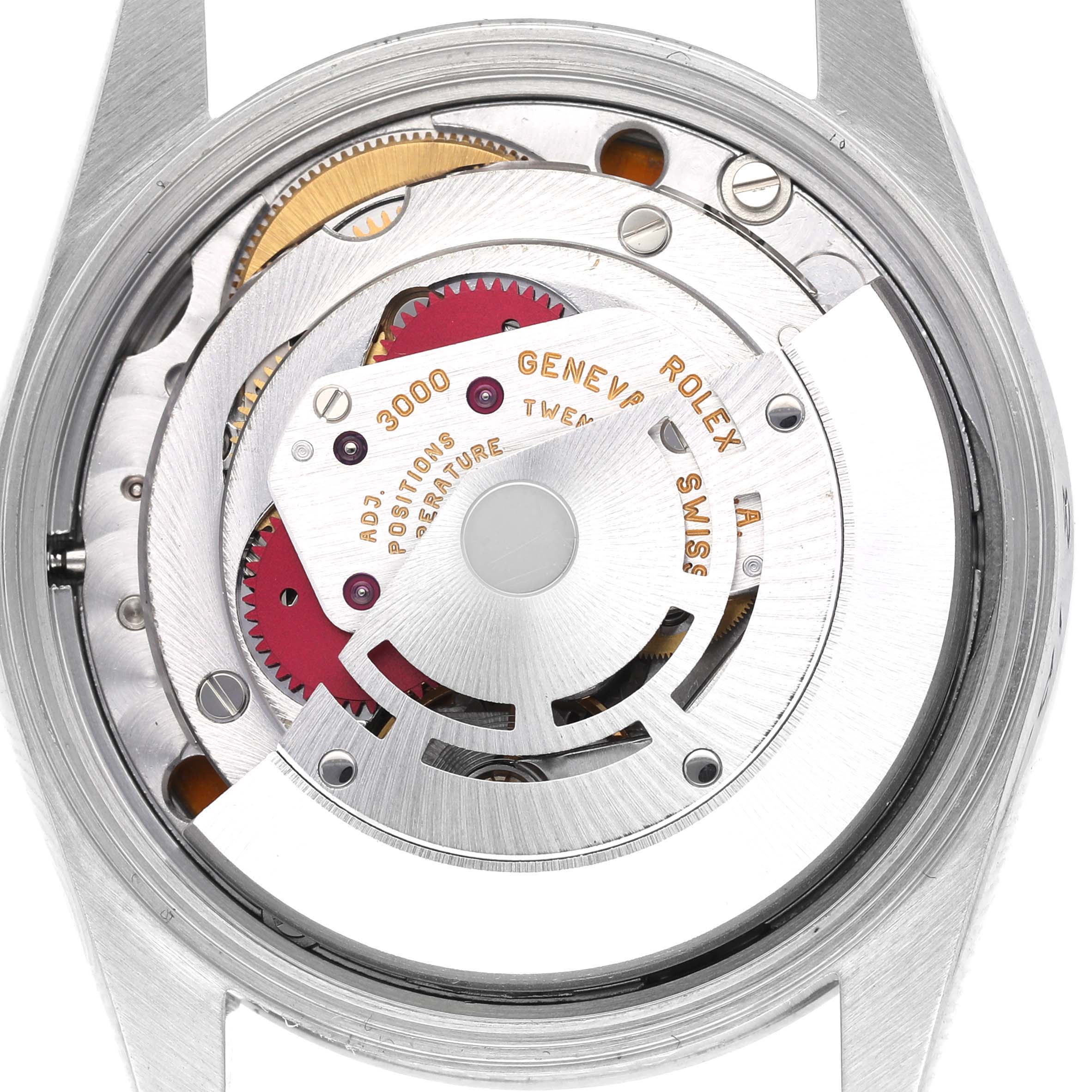 The image shows the movement of a Rolex Air-King 14000 Men's Stainless Steel Blue Dial 14000 Men's Stainless Steel Blue Dial watch from the back, highlighting gears and intricate mechanical parts.