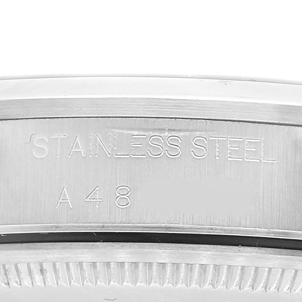 The image shows a close-up of the stainless steel case back of a Rolex Air-King 14000 Men's Stainless Steel Pink Dial 14000 Men's Stainless Steel Pink Dial watch.