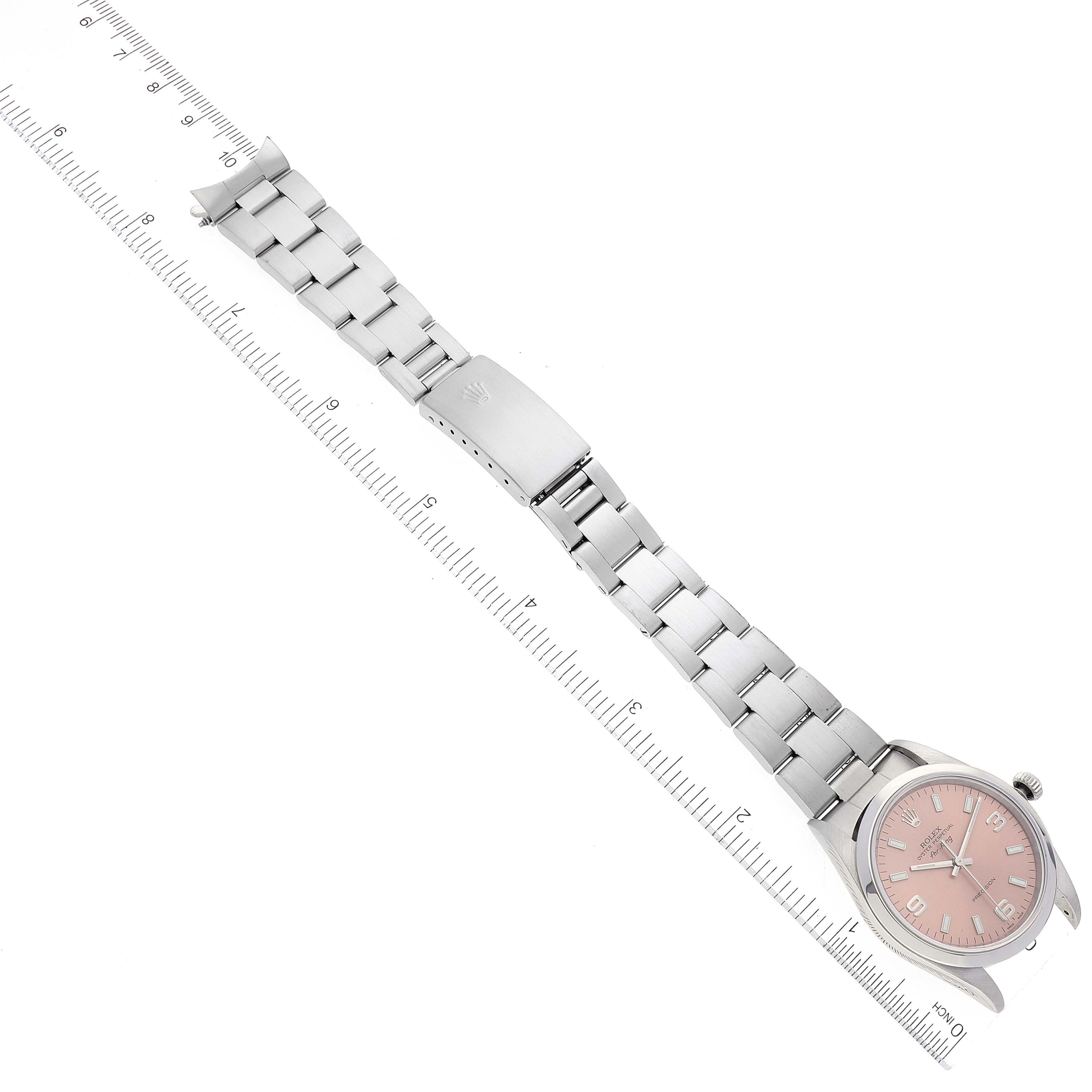 This image shows a Rolex Air-King 14000 Men's Stainless Steel Pink Dial 14000 Men's Stainless Steel Pink Dial watch laid flat alongside a ruler, displaying the entire watch including the dial and bracelet.