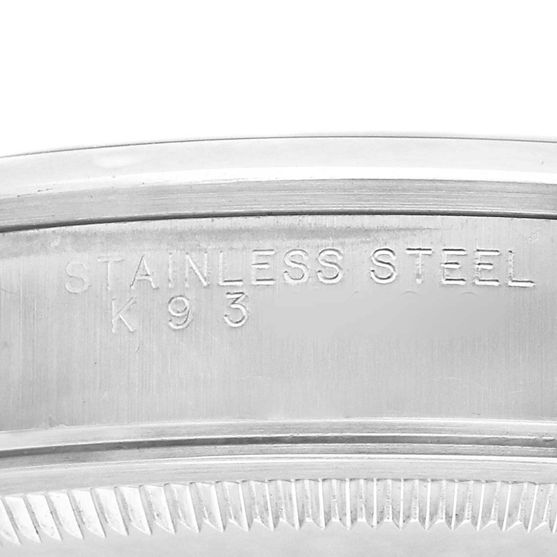 The image shows a close-up of the case side of the Rolex Air-King 14000 Men's Stainless Steel Blue Dial, highlighting the "Stainless Steel" engraving.