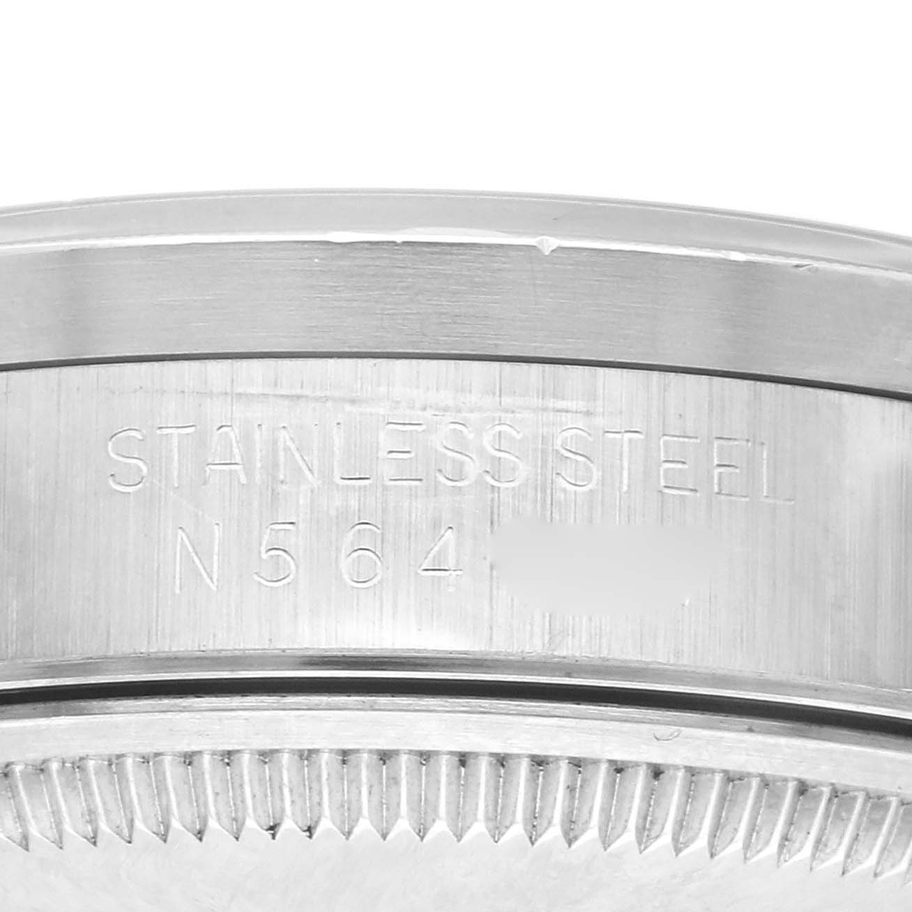 The image shows a close-up of the Rolex Air-King 14010 Men's Stainless Steel Blue Dial 14010 Men's Stainless Steel Blue Dial's stainless steel back case, highlighting the material engraving.