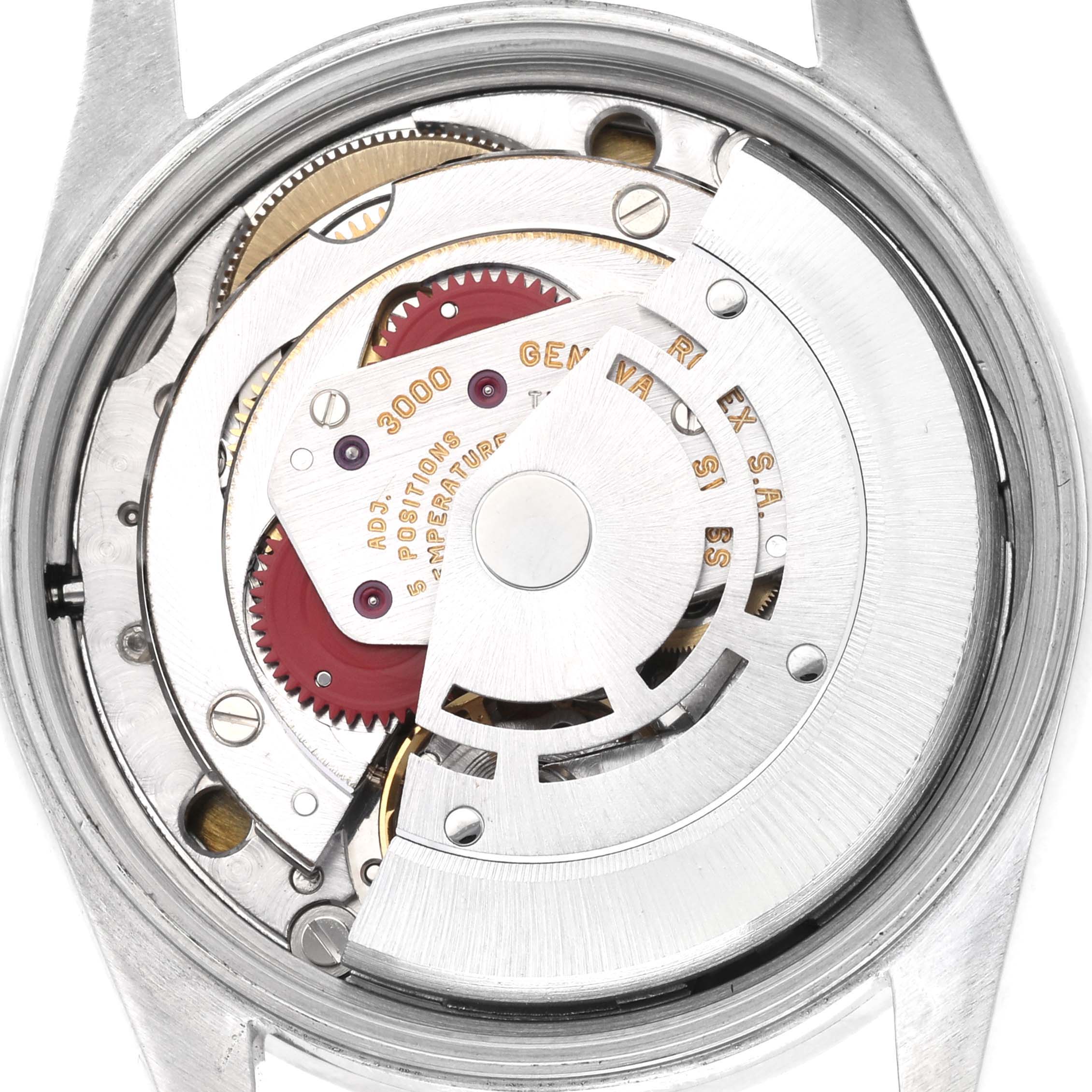 The image shows the internal movement mechanism of a Rolex Air-King 14010 Men's Stainless Steel Blue Dial 14010 Men's Stainless Steel Blue Dial watch from a top-down angle, highlighting gears and rotors.