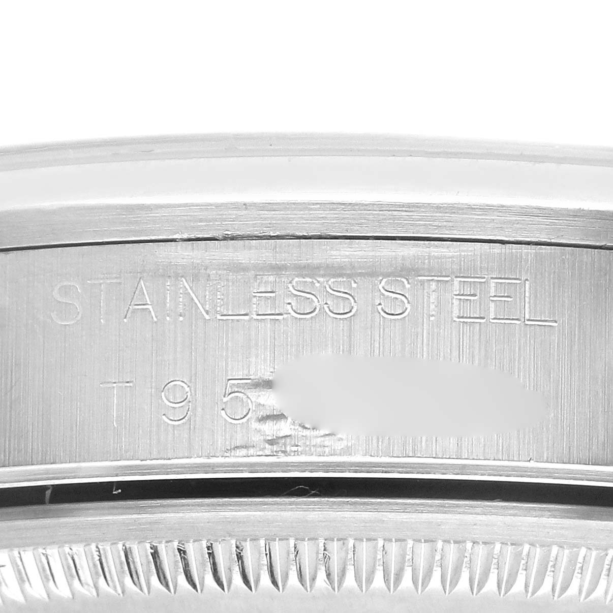 The image shows a close-up side view of the Rolex Air-King 14000 Men's Stainless Steel White Dial 14000 Men's Stainless Steel White Dial's stainless steel case edge, highlighting the engraved details.
