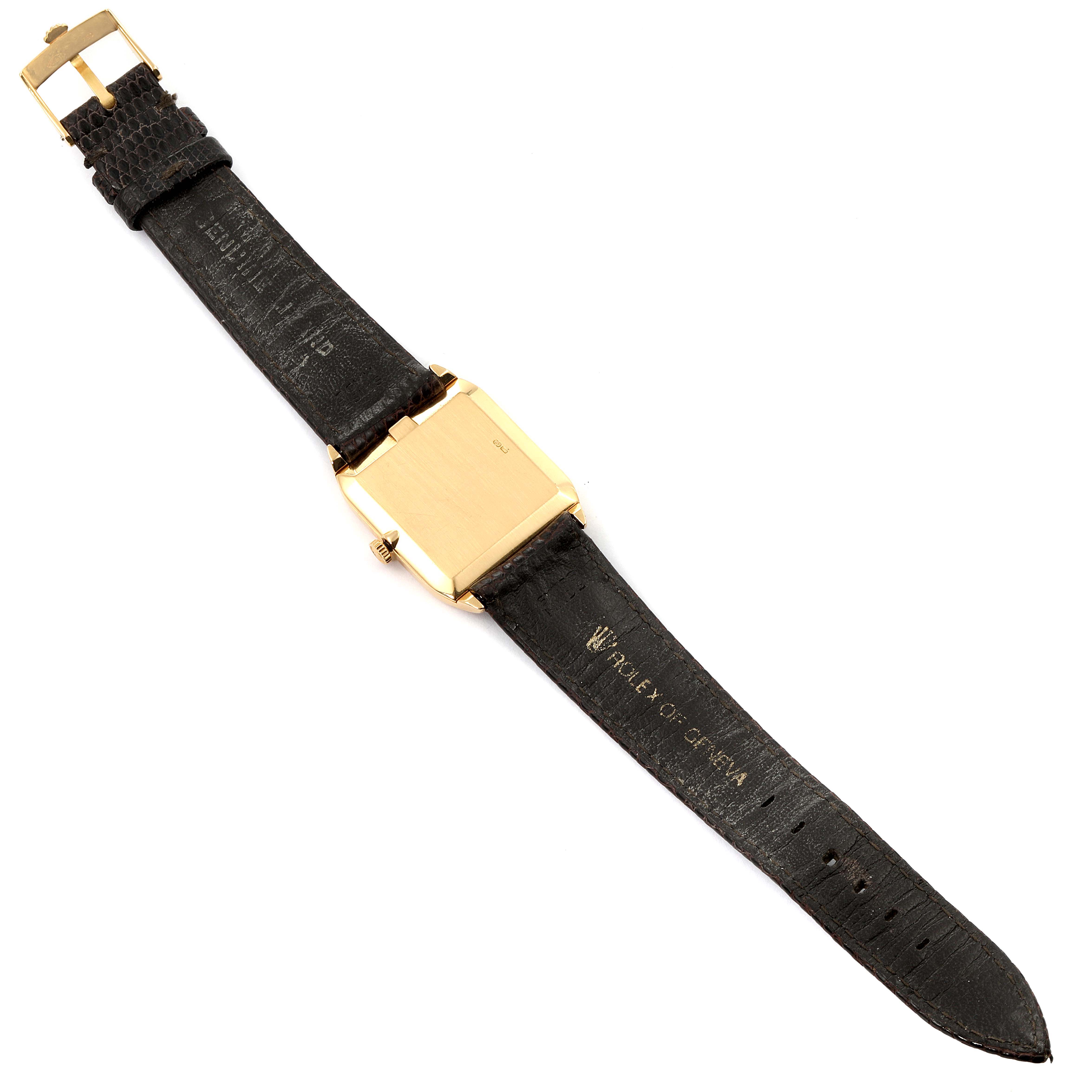 The image shows the back view of a Rolex Cellini 4135 Men's Yellow Gold Champagne Dial 4135 Men's Yellow Gold Champagne Dial watch, highlighting the black leather strap and gold case.