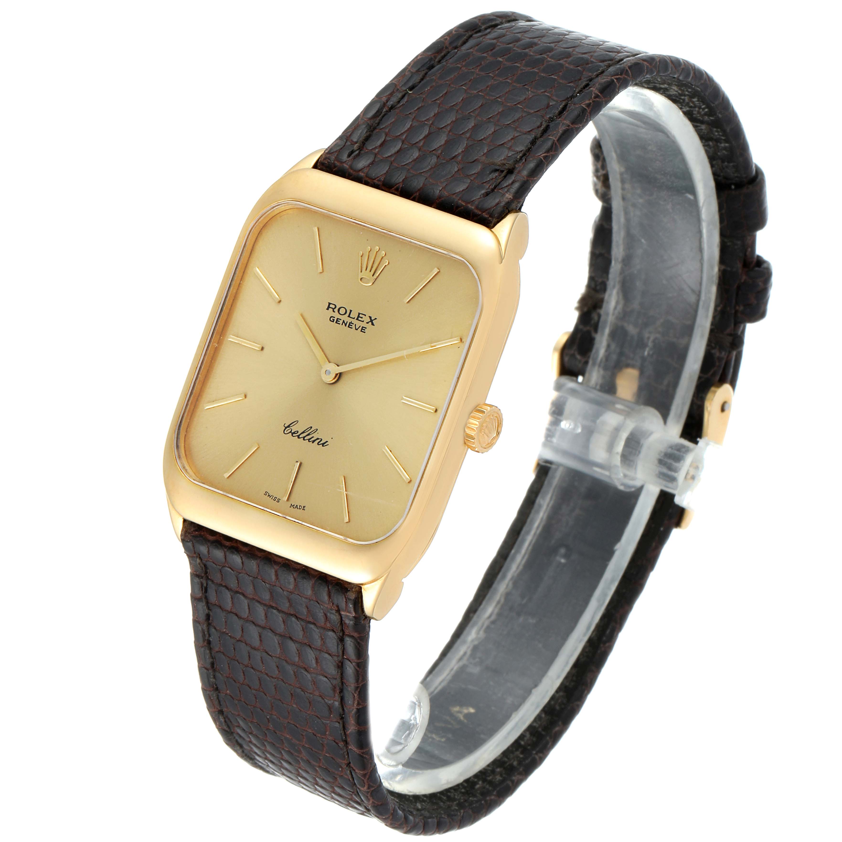 This image shows a Rolex Cellini 4135 Men's Yellow Gold Champagne Dial 4135 Men's Yellow Gold Champagne Dial watch at a three-quarter angle, highlighting its gold case and brown leather strap.