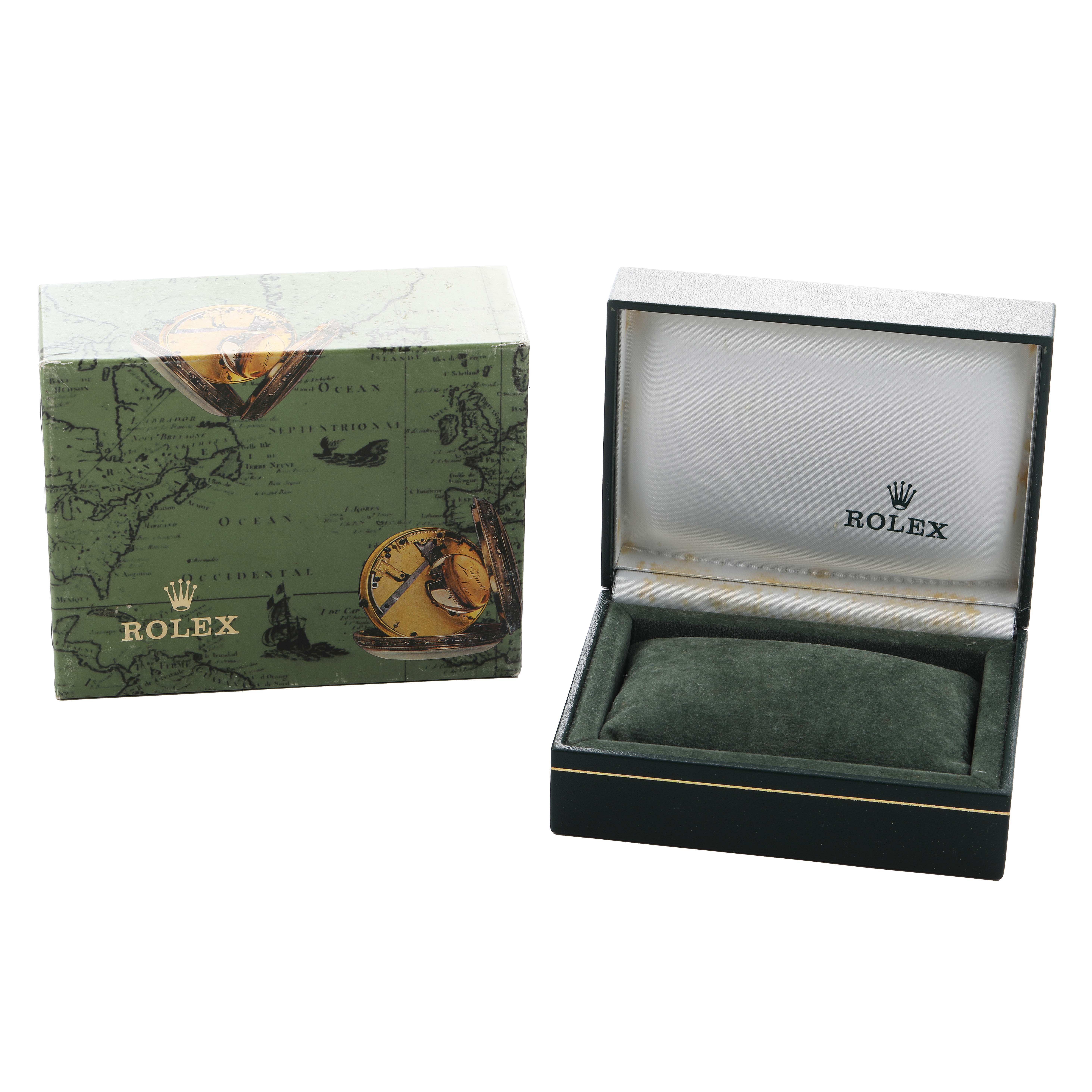 The image shows a Rolex Date 79160 Women's Stainless Steel Pink Dial model watch box and a green cushion inside the open case, angled from the front.