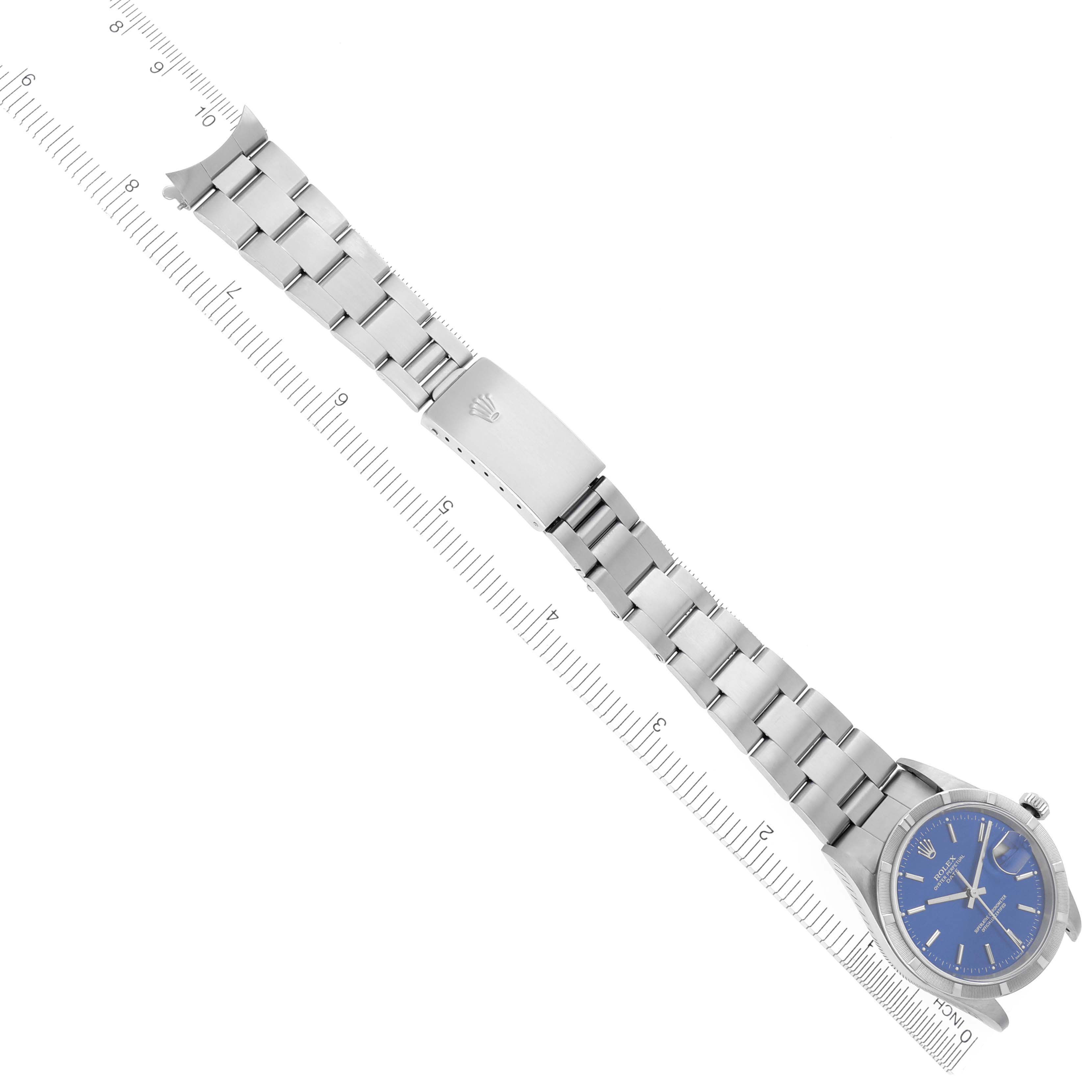 The image shows a Rolex Date 15210 Men's Stainless Steel Blue Dial 15210 Men's Stainless Steel Blue Dial watch laid flat with a focus on the bracelet and clasp from a top-down angle.