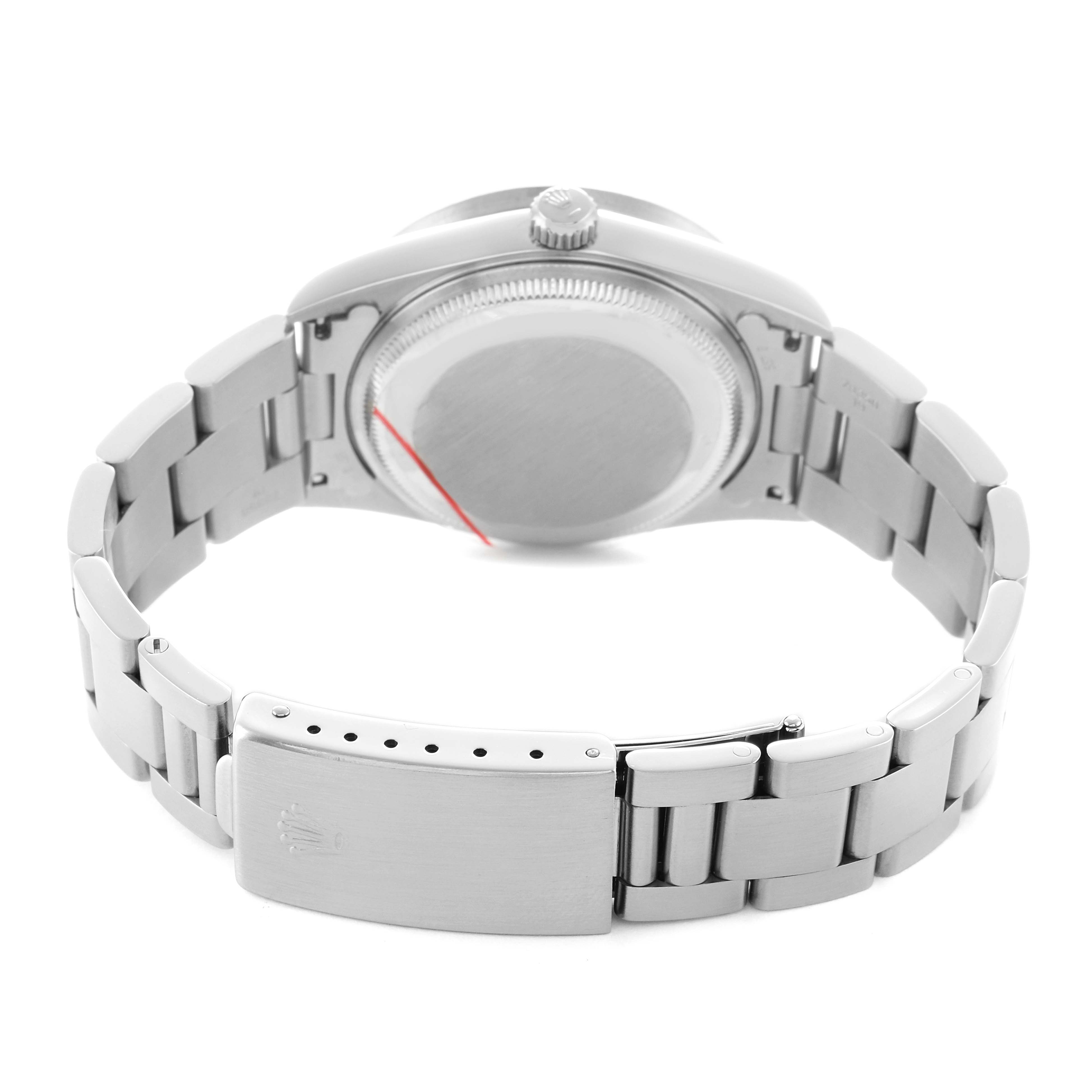 The image shows the backside of a Rolex Date 15210 Men's Stainless Steel Silver Dial watch, featuring the case back, crown, and metal bracelet with clasp.