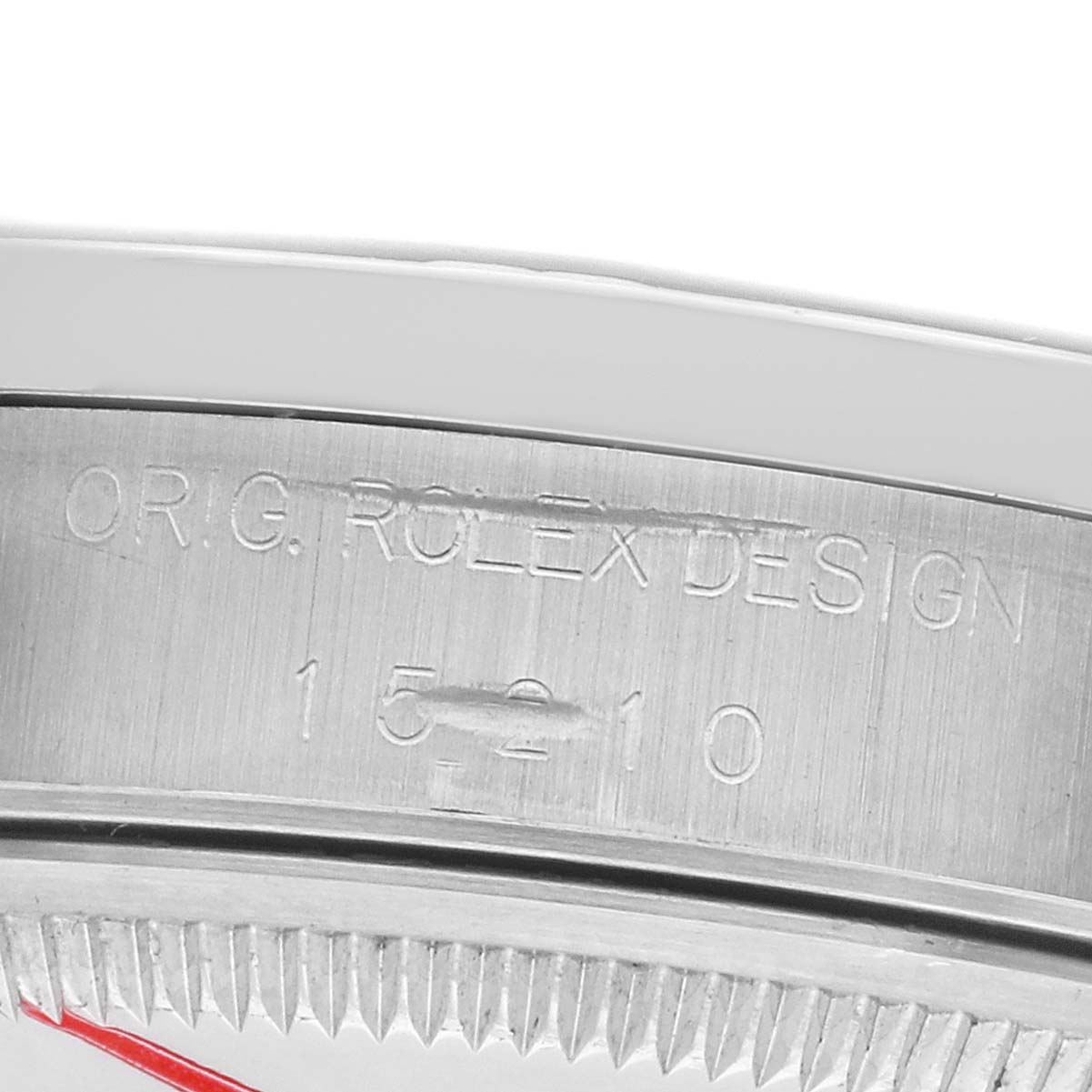 The image shows the case side of a Rolex Date 15210 Men's Stainless Steel Silver Dial model, highlighting the engraved design and model number.