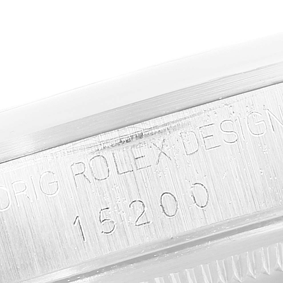 This image shows a close-up of the serial and model number engraving on the case of a Rolex Date 15200 Men's Stainless Steel Silver Dial 15200 Men's Stainless Steel Silver Dial 15200 watch.