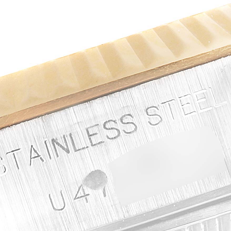 The image shows a close-up of the side of a Rolex Datejust 69173 Women's Steel and Gold (two tone) Blue Dial 69173 Women's Steel and Gold (two tone) Blue Dial, highlighting the stainless steel material and partial serial number.