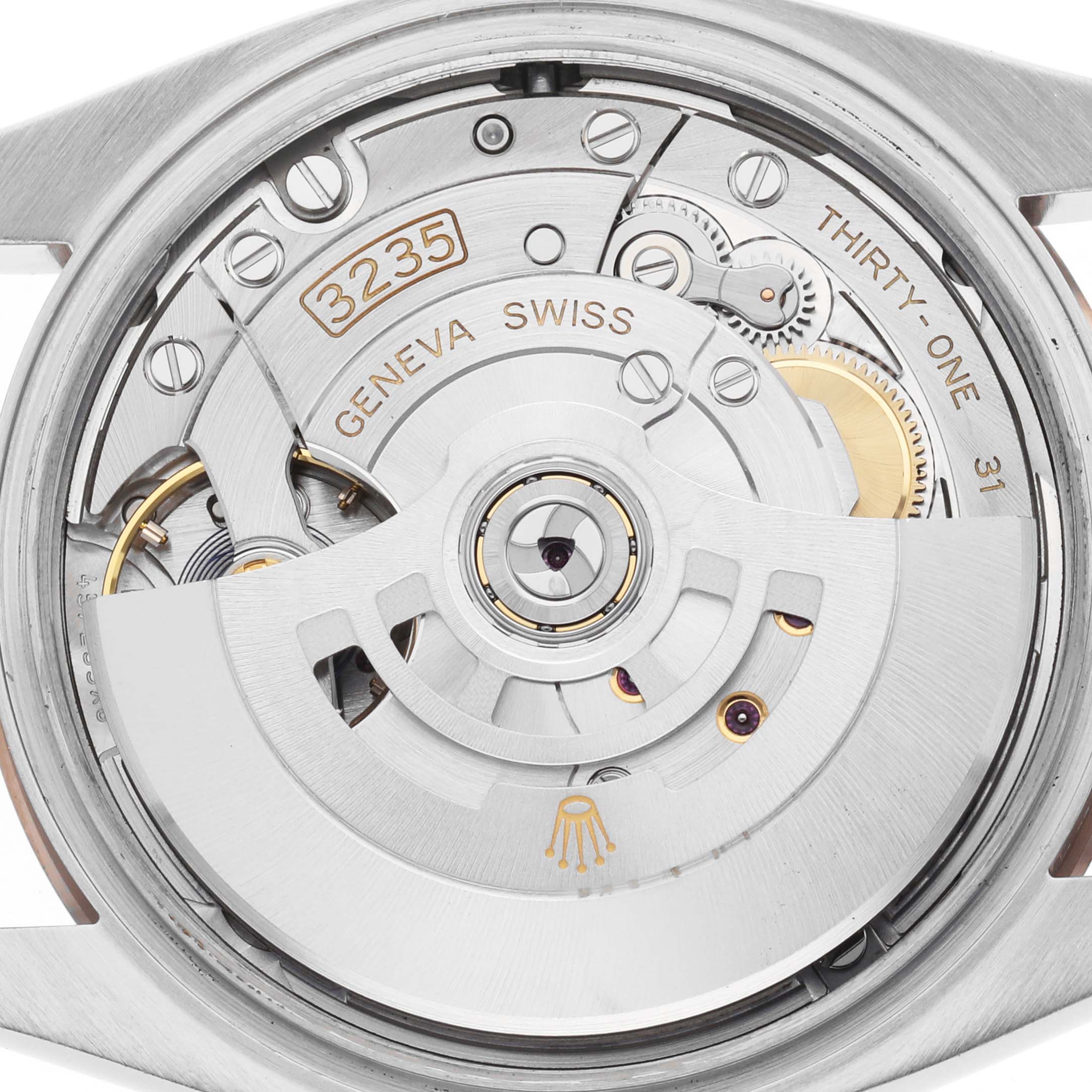 The image shows a close-up of the movement mechanism inside a Rolex Datejust 126231 Men's Stainless Steel Grey Dial watch, highlighting the rotor and gears.