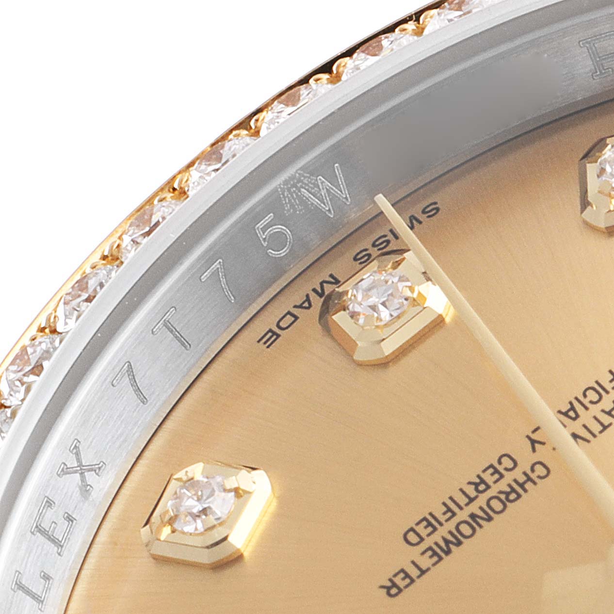 This close-up shows the bezel, dial, hour markers, and part of the "Swiss Made" text of the Rolex Datejust 116243 Men's Steel and Gold (two tone) Champagne Dial 116243 Men's Steel and Gold (two tone) Champagne Dial watch.