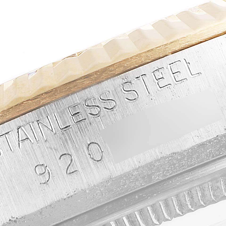 The image shows a close-up of the side engraving on a Rolex Datejust 16013 Men
s Steel and Gold (two tone) Champagne Dial 16013 Men
s Steel and Gold (two tone) Champagne Dial watch, focusing on the stainless steel part and model number.