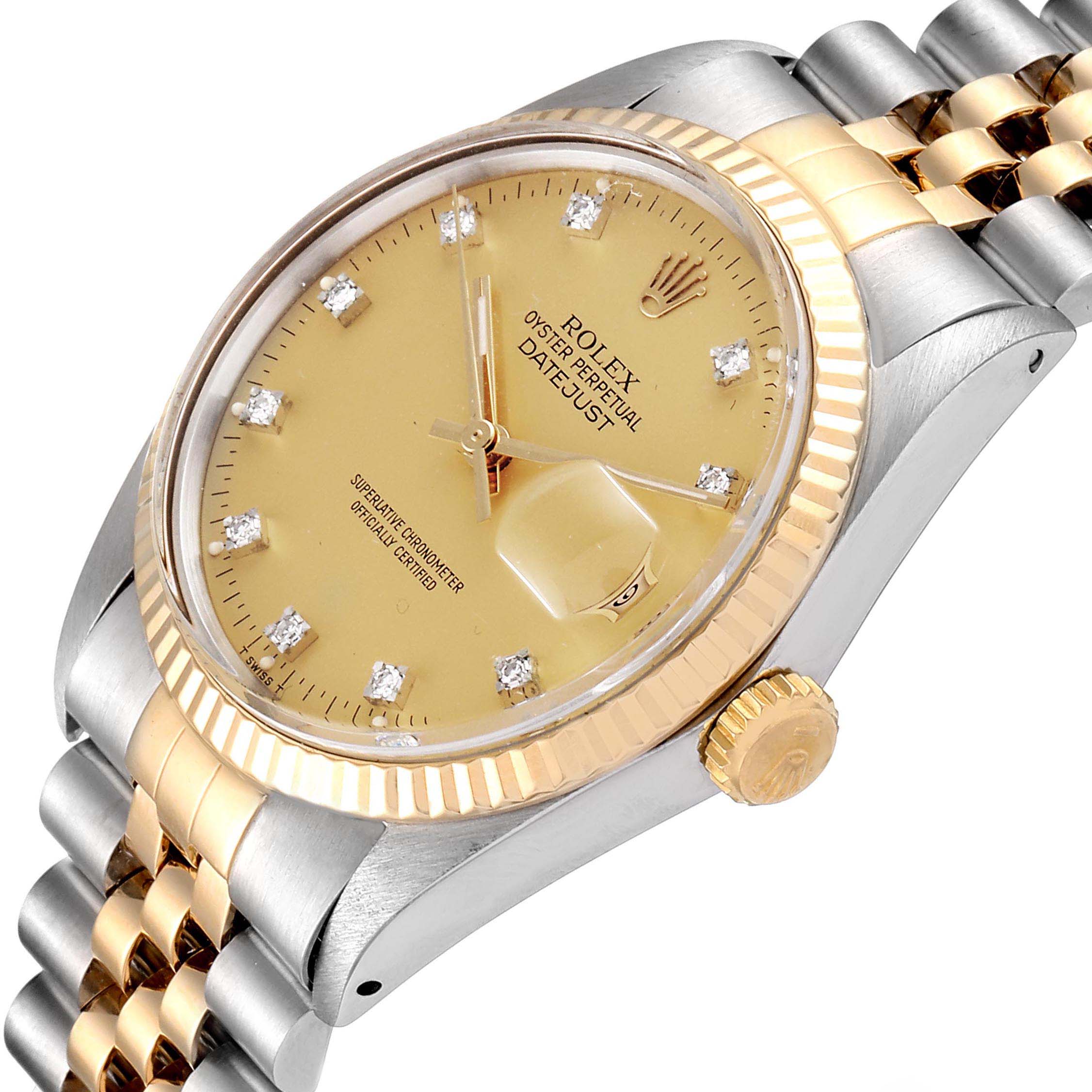 The Rolex Datejust 16013 Men
s Steel and Gold (two tone) Champagne Dial 16013 Men
s Steel and Gold (two tone) Champagne Dial watch is shown from a tilted close-up angle, highlighting its gold dial, bezel, crown, and two-tone bracelet.