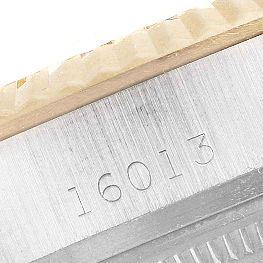 This image shows a close-up of the engraved reference number "16013" on the case of a Rolex Datejust 16013 Men
s Steel and Gold (two tone) Champagne Dial 16013 Men
s Steel and Gold (two tone) Champagne Dial.