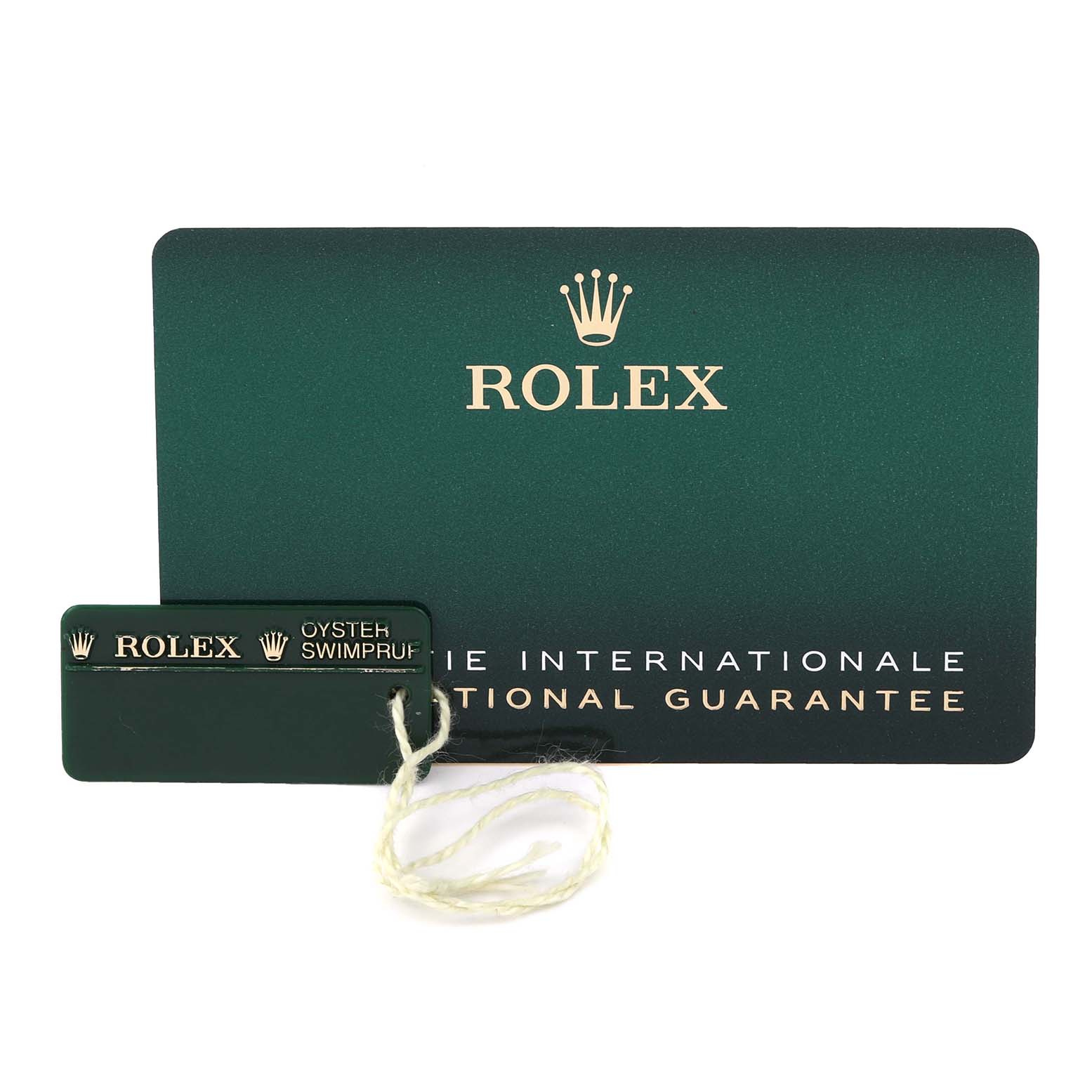 The image shows the Rolex Datejust 116139 Men's White Gold Silver Dial 116139 Men's White Gold Silver Dial's international guarantee card and Oyster Swimpruf tag.