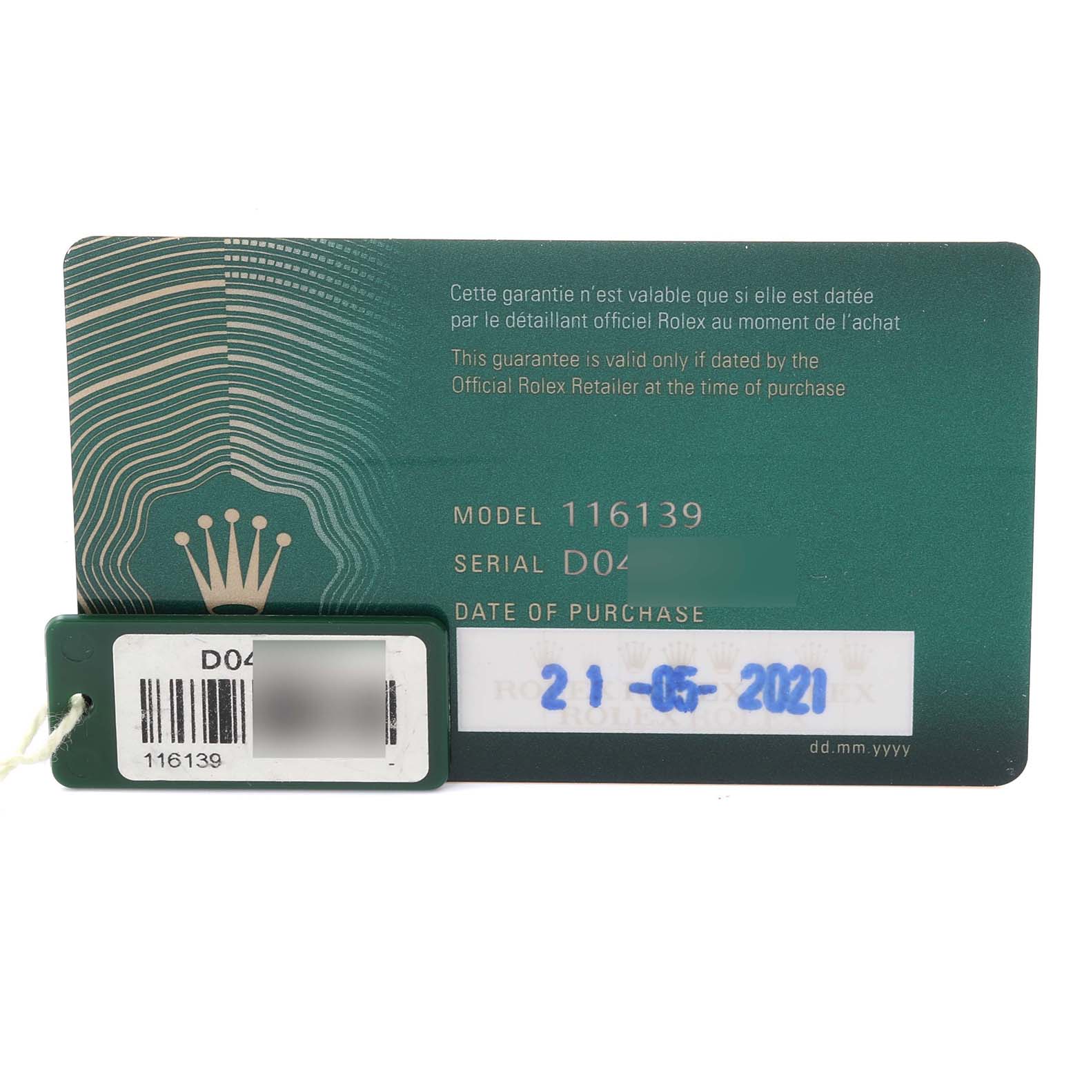The image shows a guarantee card and tag for a Rolex Datejust 116139 Men's White Gold Silver Dial 116139 Men's White Gold Silver Dial model from an overhead angle.