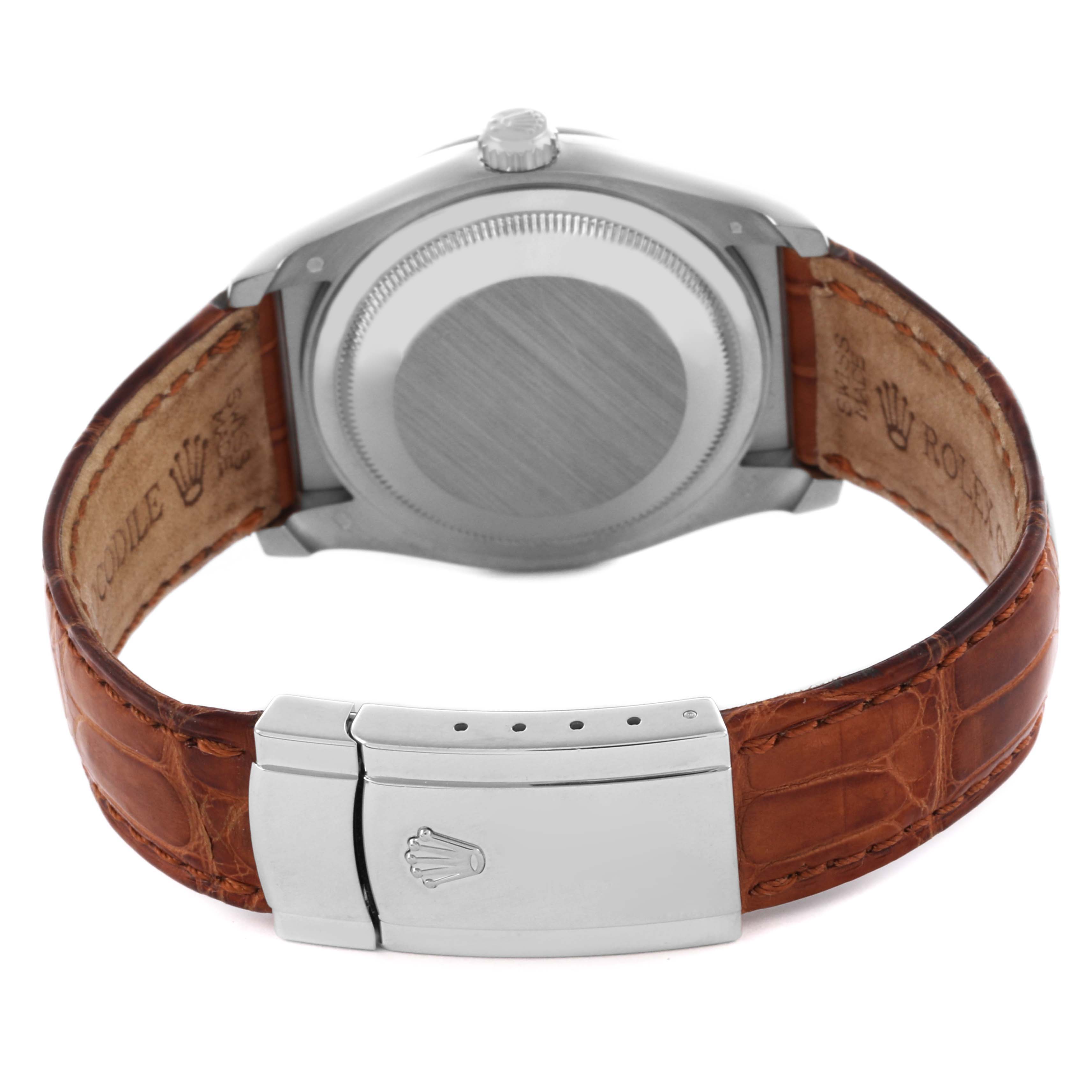 The image shows the back of a Rolex Datejust 116139 Men's White Gold Silver Dial 116139 Men's White Gold Silver Dial watch, highlighting the case back, clasp, and brown leather strap.