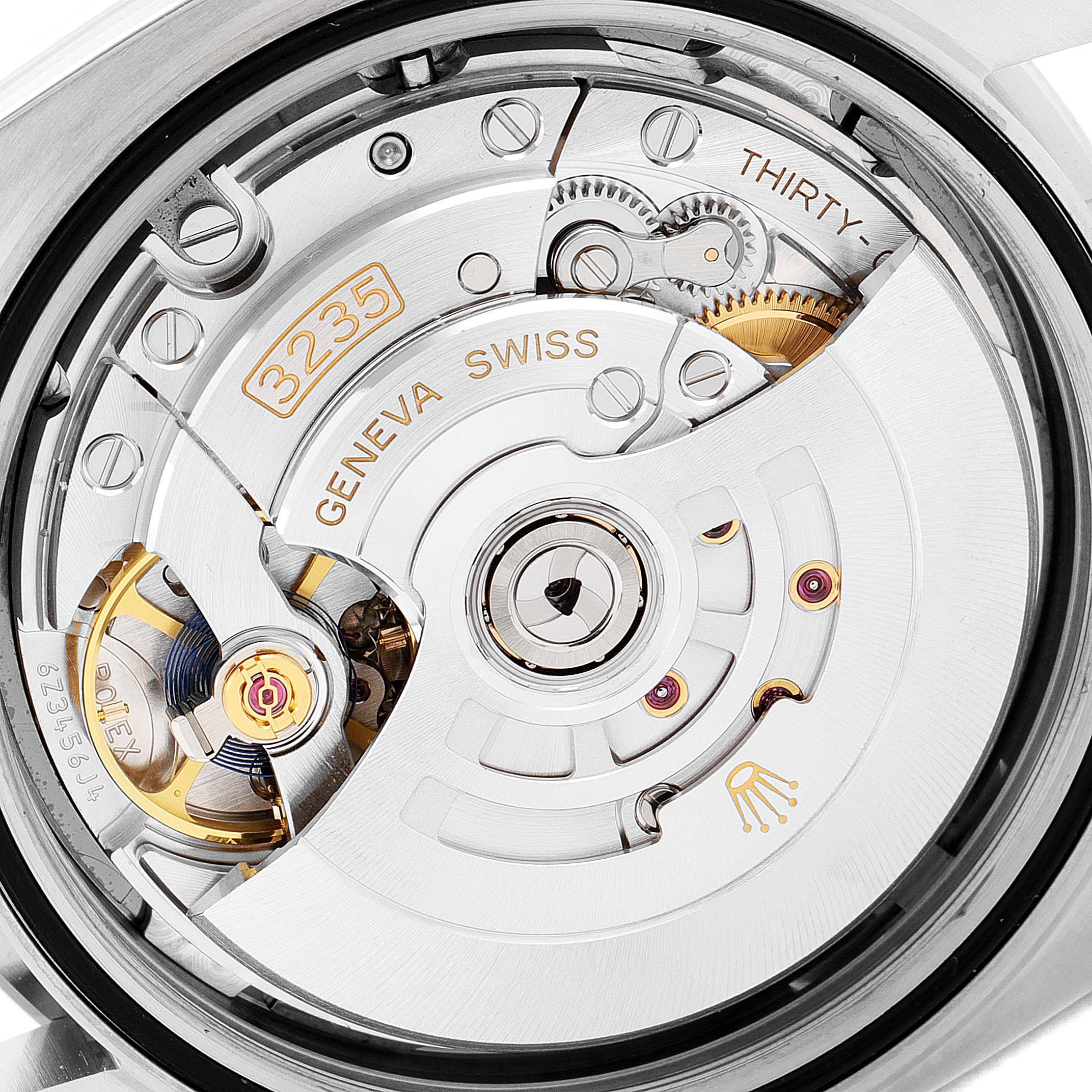 The image shows a close-up view of the Rolex Datejust 41 126334 Men's Stainless Steel Grey Dial 126334 Men's Stainless Steel Grey Dial's movement, highlighting the intricate internal mechanism.