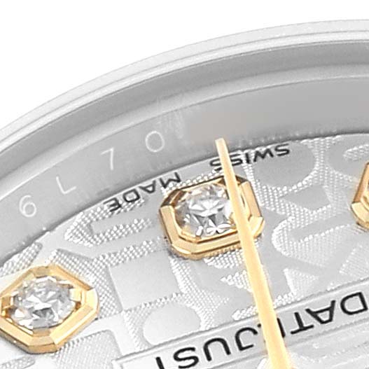 The image shows a close-up of the Rolex Datejust 179173 Women's Steel and Gold (two tone) Silver Dial watch face, featuring gold hour markers with diamonds and partial text.