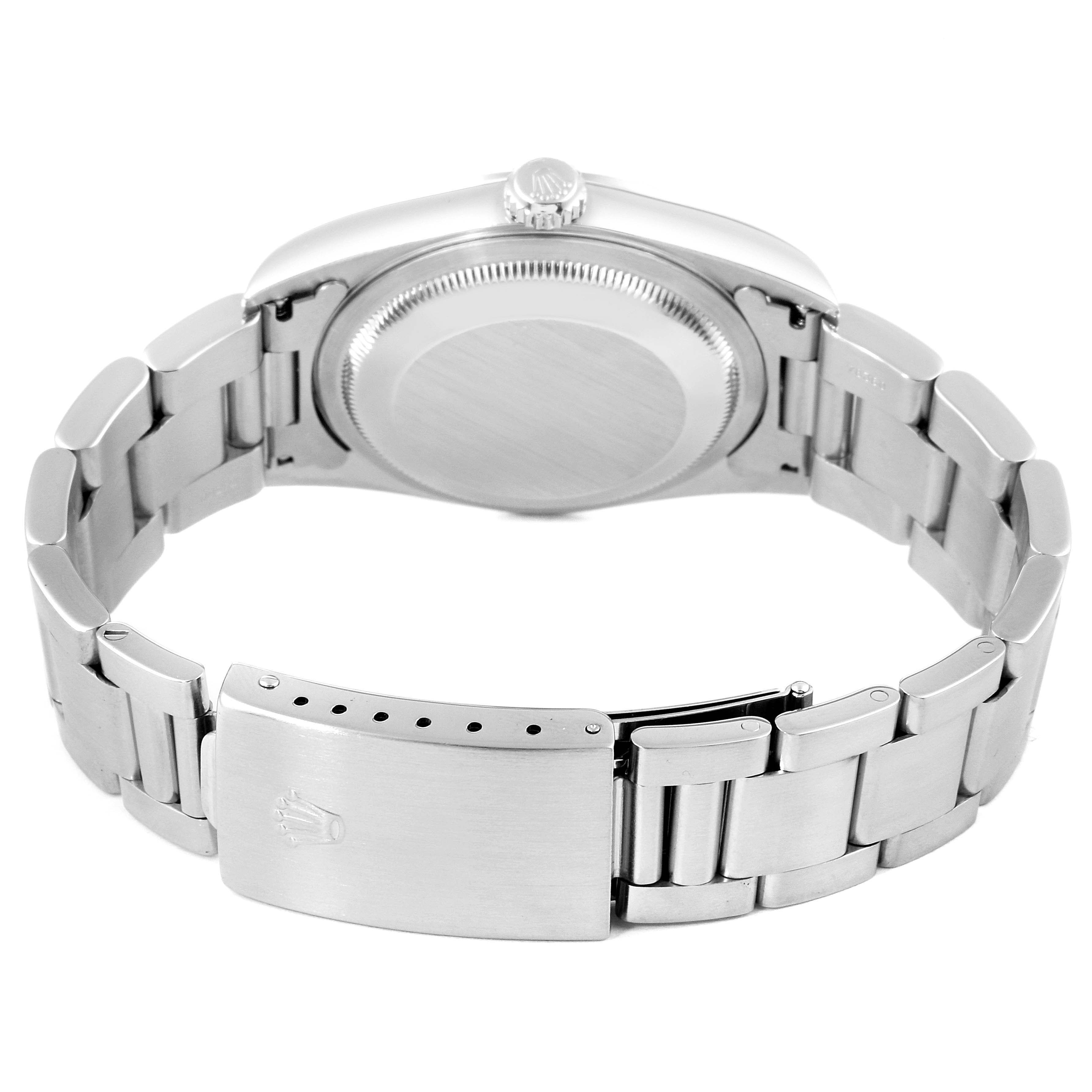 The image shows the back view of a Rolex Datejust 16200 Men
s Stainless Steel Blue Dial 16200 Men
s Stainless Steel Blue Dial watch, featuring its clasp, caseback, and bracelet.