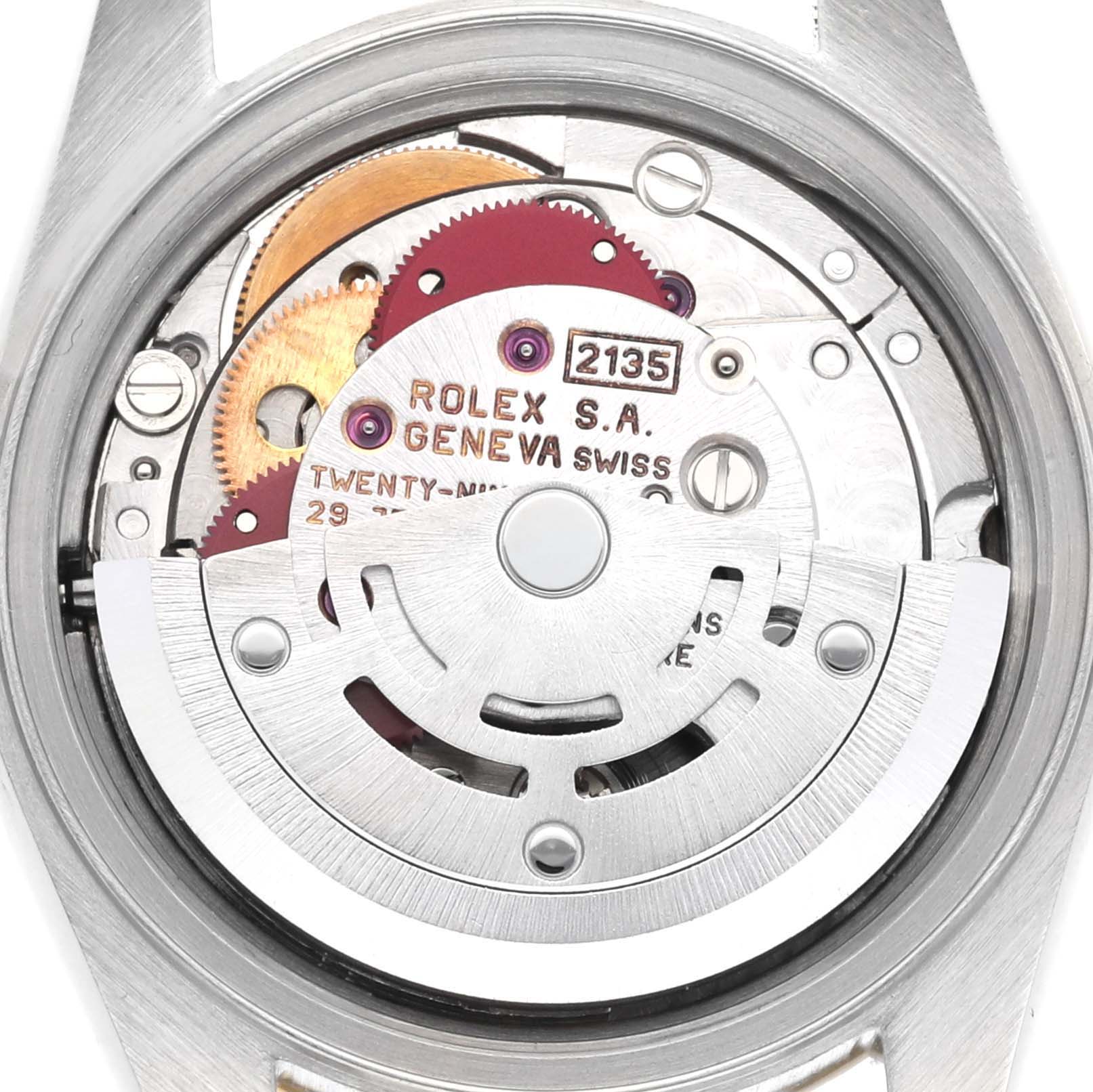 The image shows the movement of a Rolex Datejust 69173 Women's Steel and Gold (two tone) Blue Dial 69173 Women's Steel and Gold (two tone) Blue Dial watch from a rear angle, highlighting gears and the rotor.