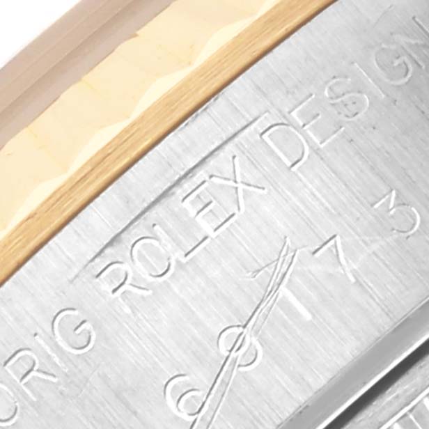 The image shows a close-up of the engraving on a Rolex Datejust 69173 Women's Steel and Gold (two tone) Blue Dial 69173 Women's Steel and Gold (two tone) Blue Dial case side.