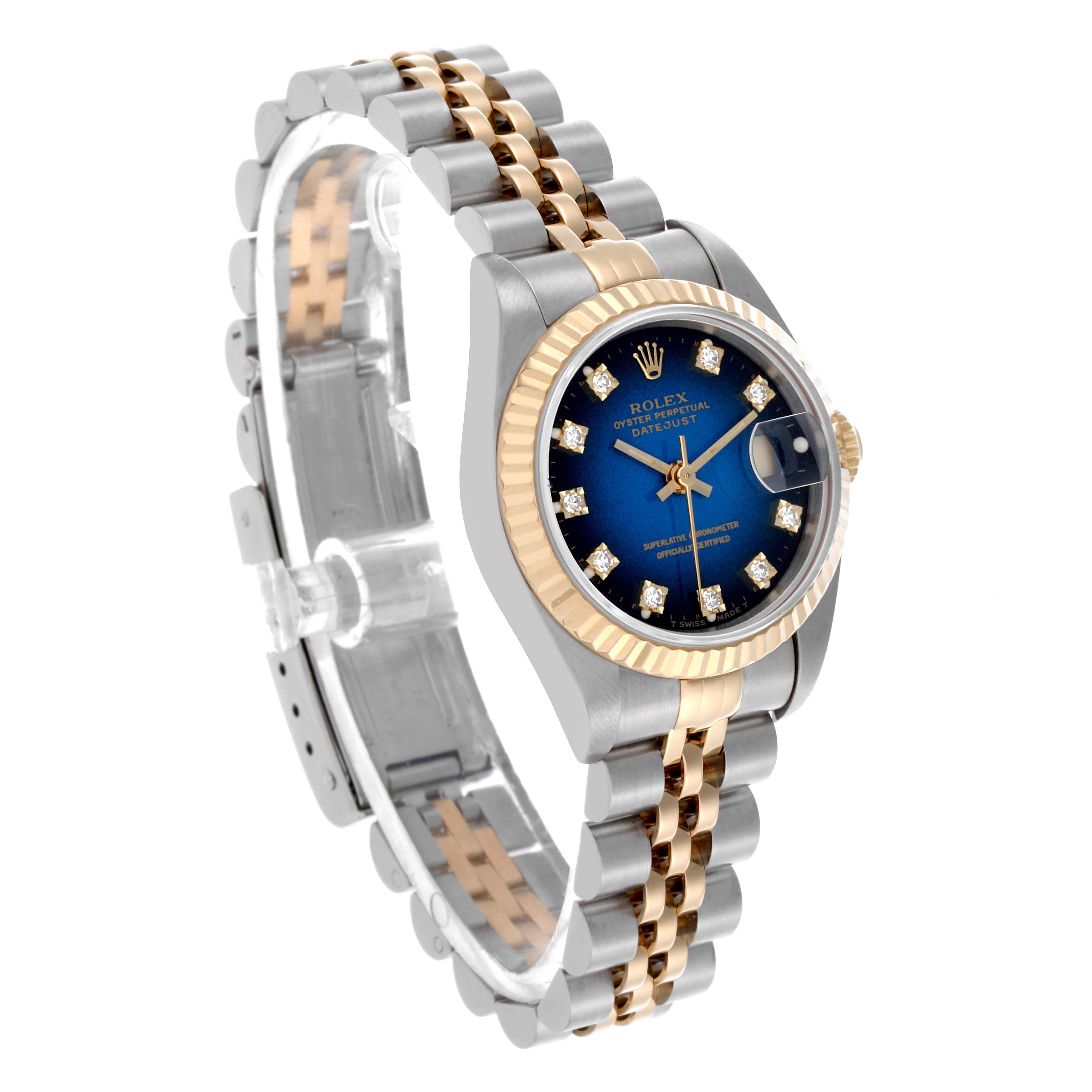 The Rolex Datejust 69173 Women's Steel and Gold (two tone) Blue Dial 69173 Women's Steel and Gold (two tone) Blue Dial watch is shown at a front-side angle, featuring its blue dial, diamond hour markers, and jubilee bracelet.