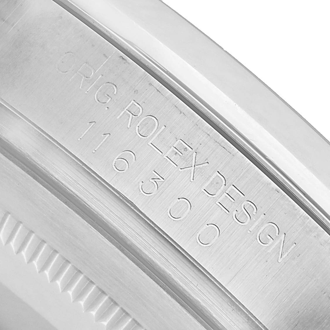 The image shows a close-up of the engravings on the inner bezel of a Rolex Datejust 41 116300 Men's Stainless Steel Silver Dial watch.