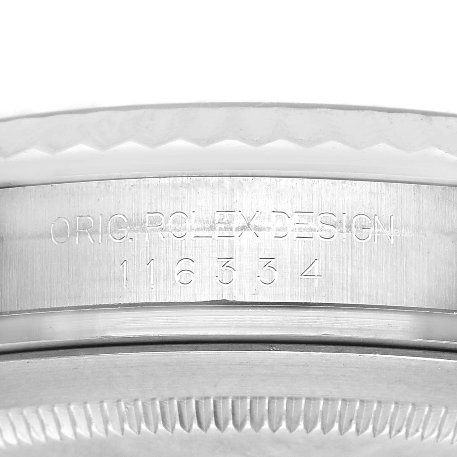 The image shows a close-up side view of the casing on a Rolex Datejust 41 116334 Men's Stainless Steel Blue Dial 116334 Men's Stainless Steel Blue Dial, highlighting the engraved design markings.