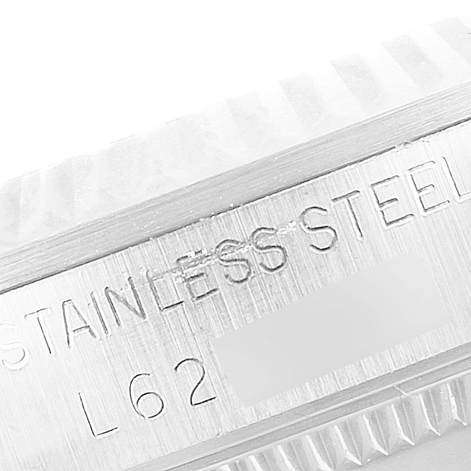 This image shows a close-up of the side of a Mid-Size Rolex watch case, highlighting the "STAINLESS STEEL" engraving.