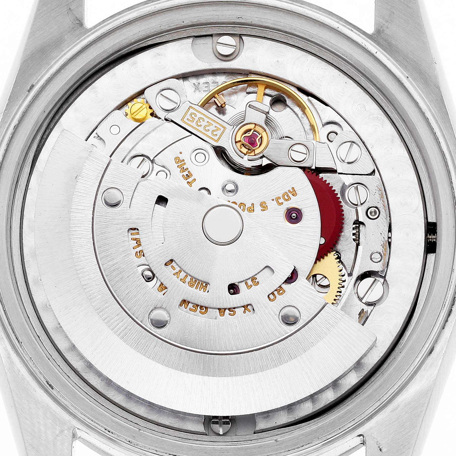 The image shows the movement from the back of a Mid-Size Rolex, highlighting gears and components.