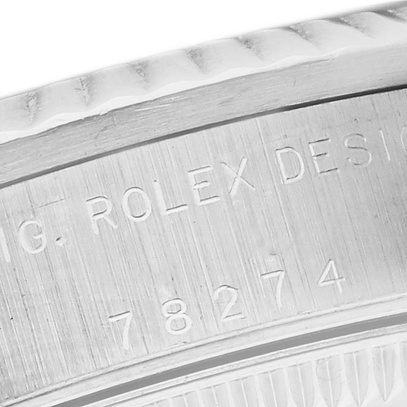 The image shows a close-up of the Rolex Mid-Size 78274 Women's Stainless Steel White Dial 78274 Women's Stainless Steel White Dial model’s engraved case back.