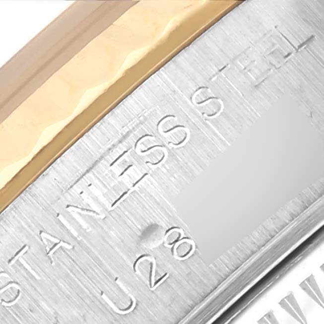 The image shows a close-up of the Rolex Datejust 69173 Women's Steel and Gold (two tone) Red Dial 69173 Women's Steel and Gold (two tone) Red Dial bezel and part of the case back, highlighting the stainless steel and gold detailing.