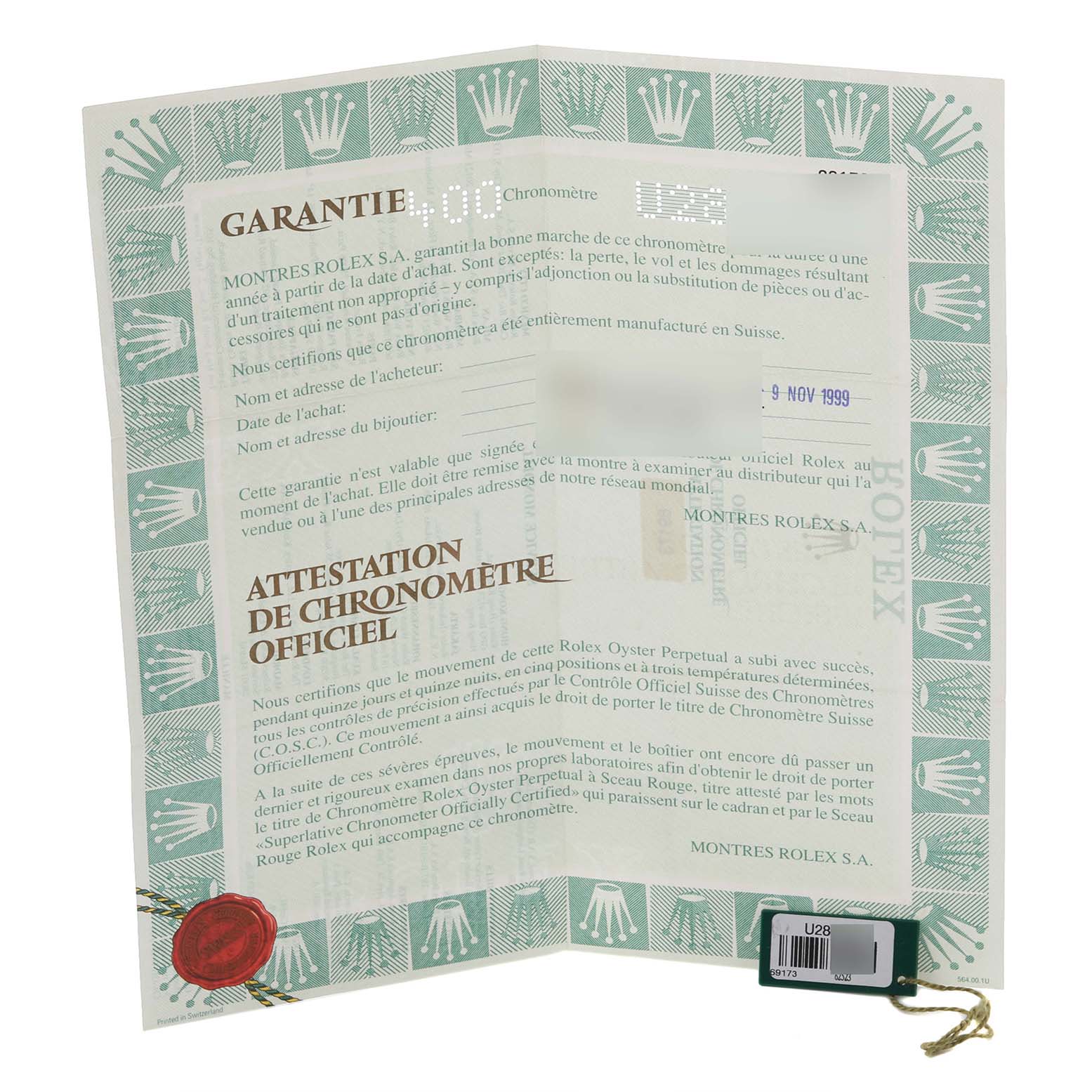 The image shows a warranty certificate and tag for a Rolex Datejust 69173 Women's Steel and Gold (two tone) Red Dial 69173 Women's Steel and Gold (two tone) Red Dial watch.