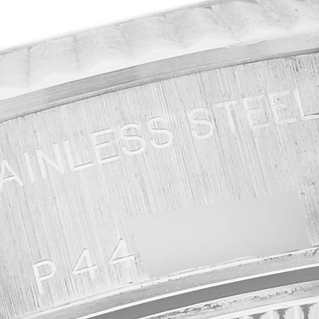 The image shows a close-up of the inner bezel with "STAINLESS STEEL" and part of a serial engraving on a Rolex Datejust 79174 Women's Stainless Steel White Dial 79174 Women's Stainless Steel White Dial.