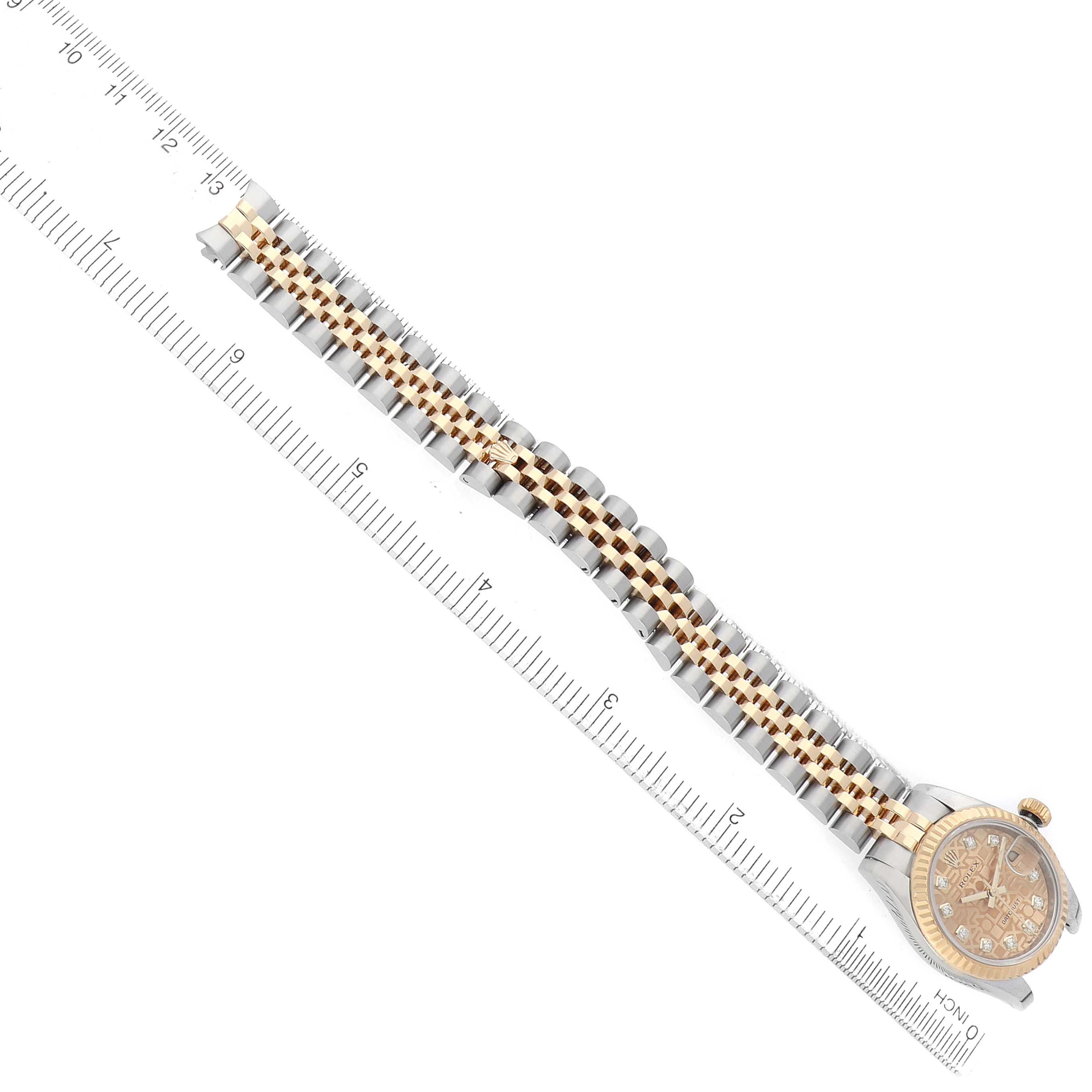 The Rolex Datejust 179173 Women's Steel and Gold (two tone) Champagne Dial watch is shown from an angled top view, highlighting the two-tone bracelet and dial.