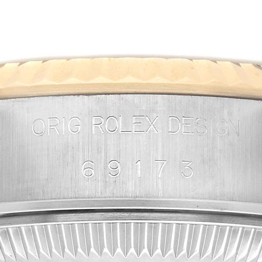 The image shows an engraved side view of the Rolex Datejust 69173 Women
s Steel and Gold (two tone) Champagne Dial 69173 Women
s Steel and Gold (two tone) Champagne Dial model case with the design number visible.