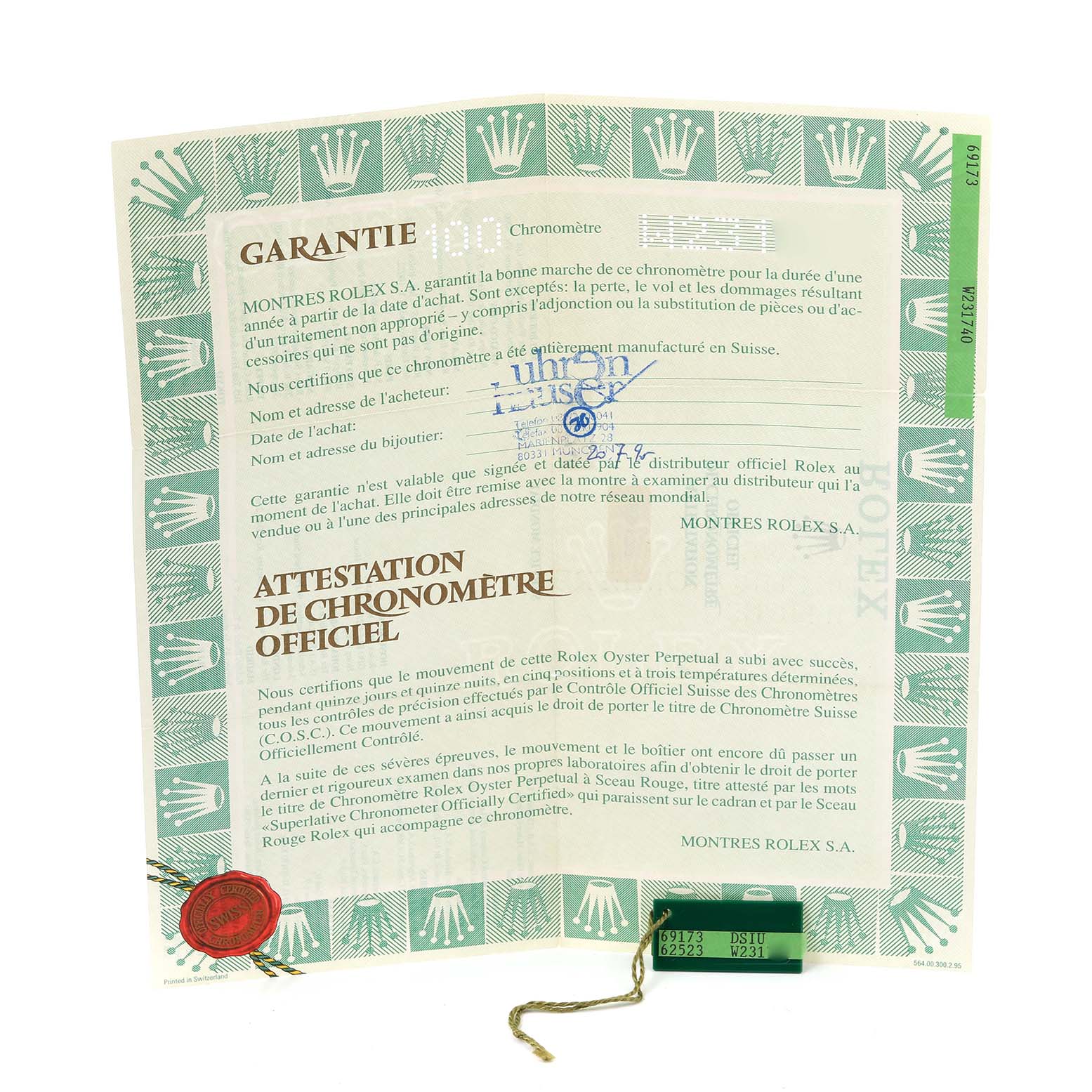 The image shows a guarantee and chronometer certificate for the Rolex Datejust 69173 Women
s Steel and Gold (two tone) Champagne Dial 69173 Women
s Steel and Gold (two tone) Champagne Dial watch, along with a green holographic tag.