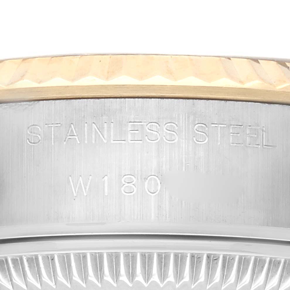 This image shows a close-up of the engraved side of the Rolex Datejust 69173 Women
s Steel and Gold (two tone) Champagne Dial 69173 Women
s Steel and Gold (two tone) Champagne Dial watch case with visible fluted edges.
