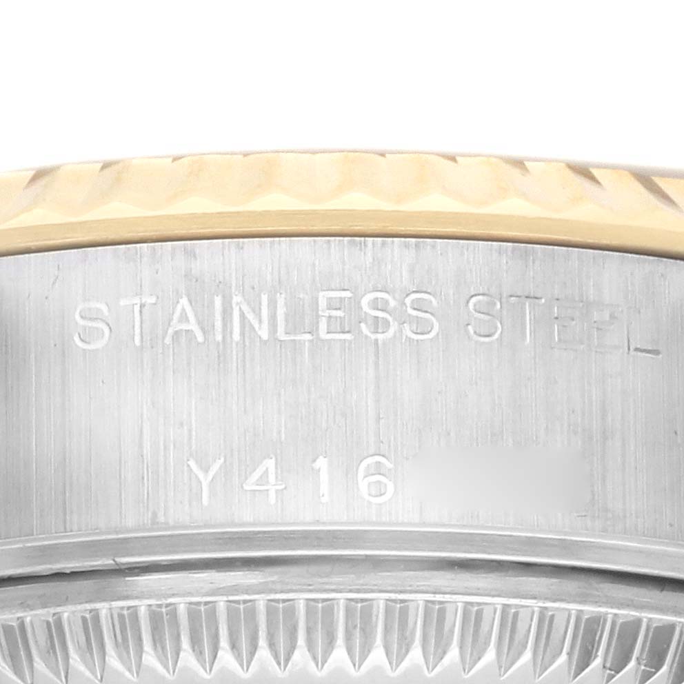 The image shows a close-up of the side of a Rolex Datejust 79173 Men's Steel and Gold (two tone) Champagne Dial 79173 Men's Steel and Gold (two tone) Champagne Dial, highlighting the stainless steel case and engravings.