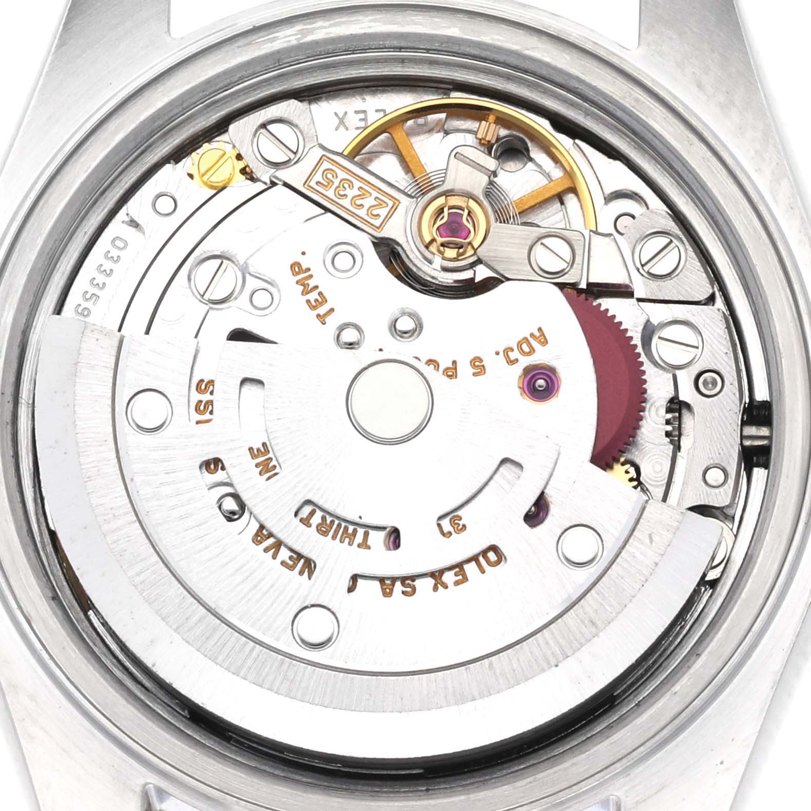 The image shows an inside view of the Rolex Datejust 79173 Women
s Steel and Gold (two tone) Champagne Dial 79173 Women
s Steel and Gold (two tone) Champagne Dial, focusing on its movement and inner mechanical components.