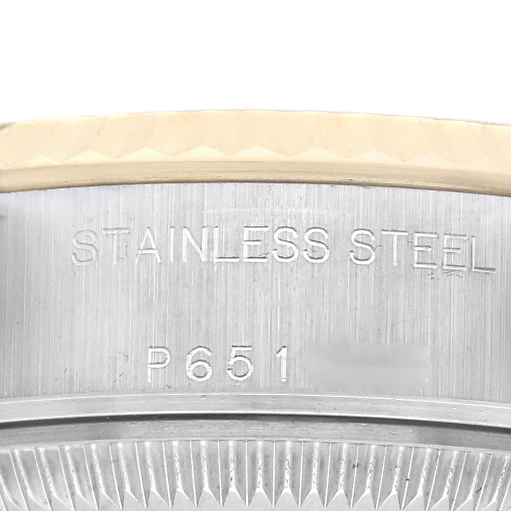 The image shows a close-up of the side casing of a Rolex Datejust 79173 Women
s Steel and Gold (two tone) Champagne Dial 79173 Women
s Steel and Gold (two tone) Champagne Dial, highlighting the "Stainless Steel" marking.