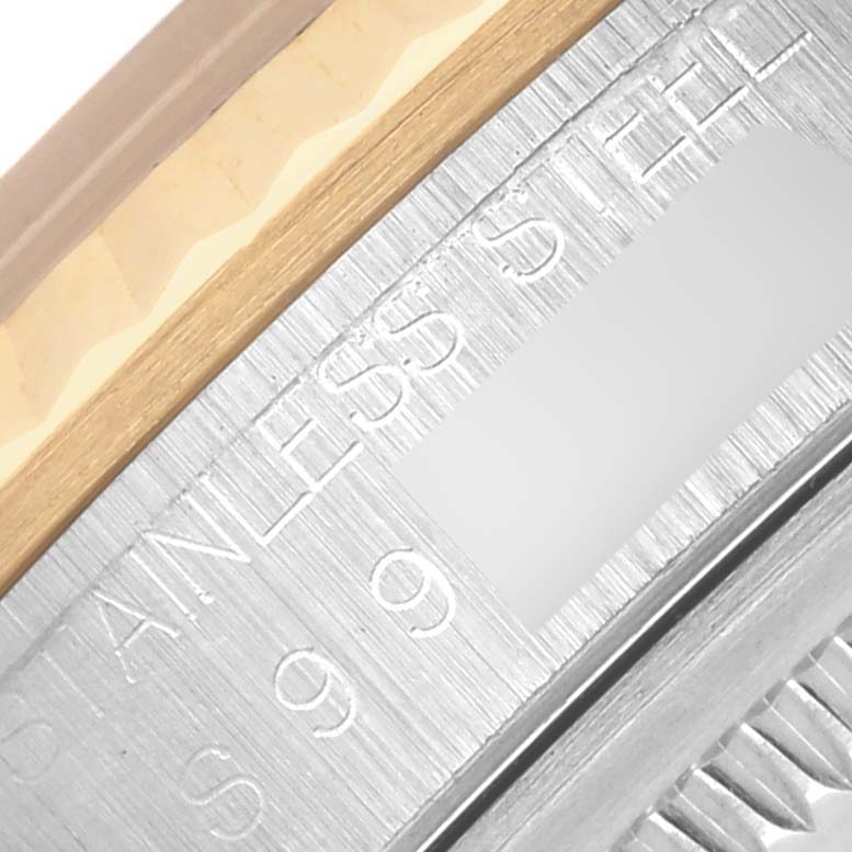 The image shows a close-up of the side of a Rolex Datejust 16233 Men's Steel and Gold (two tone) Beige Dial 16233 Men's Steel and Gold (two tone) Beige Dial, highlighting an engraved bezel edge and material detail.